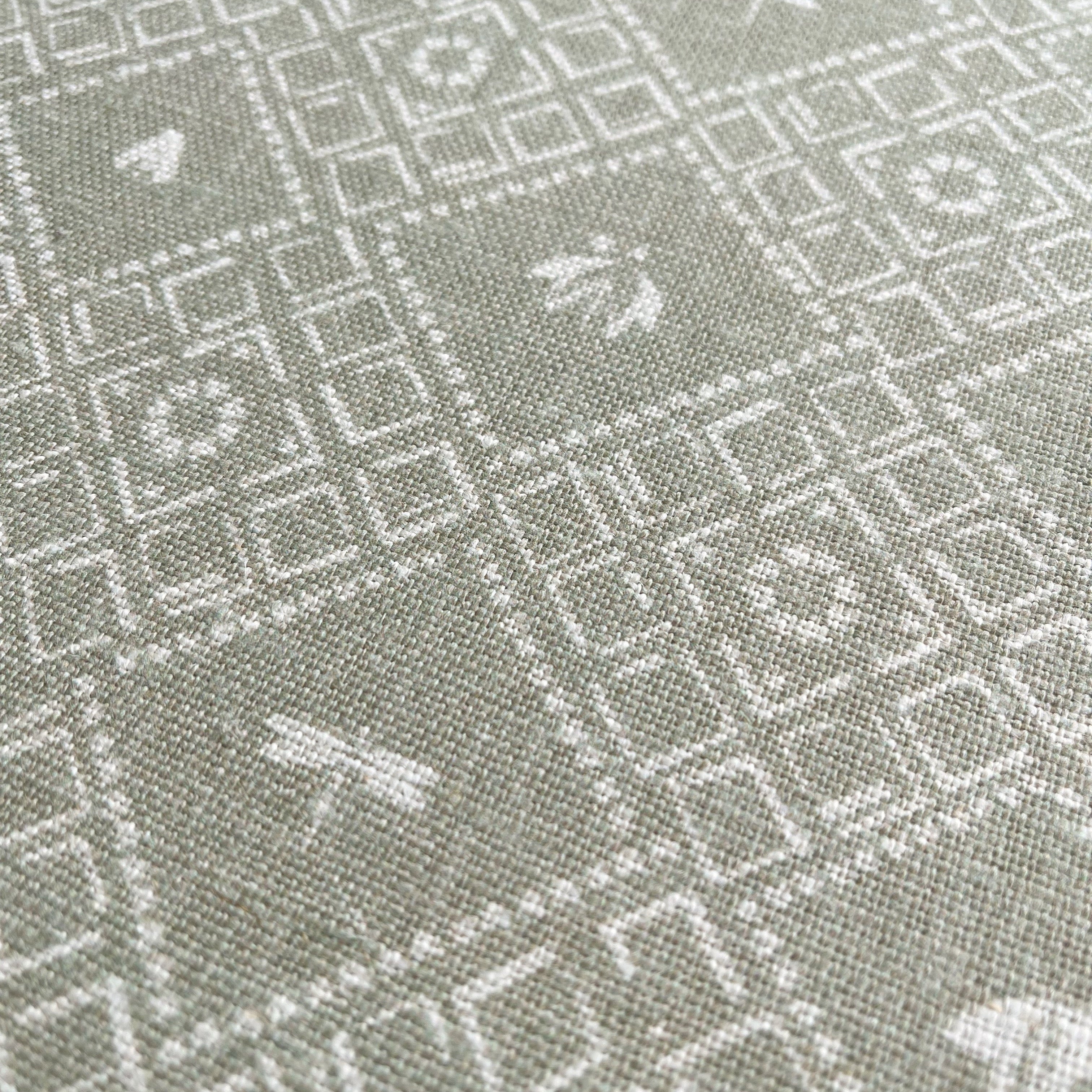 Americana pillow in Edamame – close-up of natural linen and pattern from the Fauna Collection