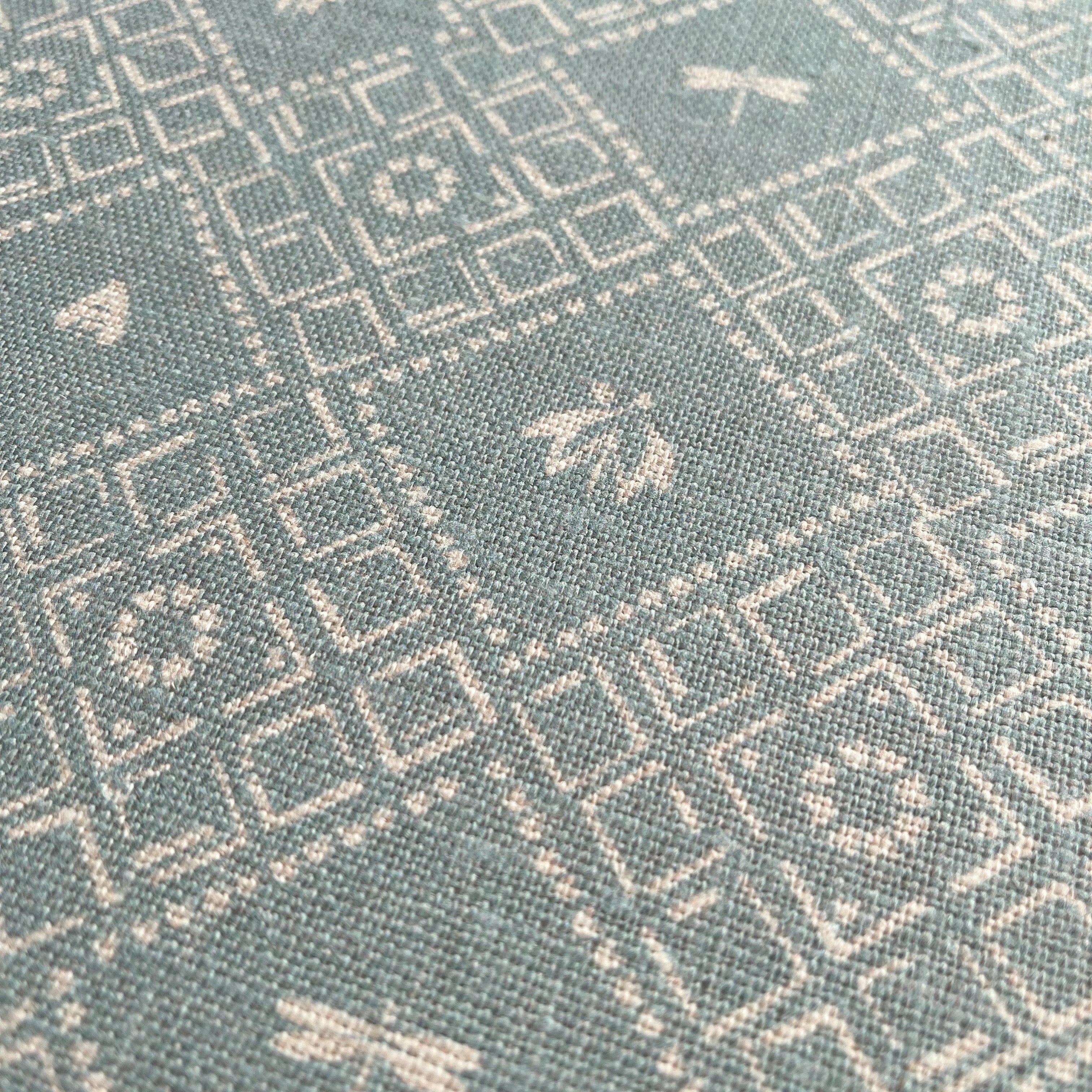 Close up Emily Daws linen Fabric, Teal dotted woodland design