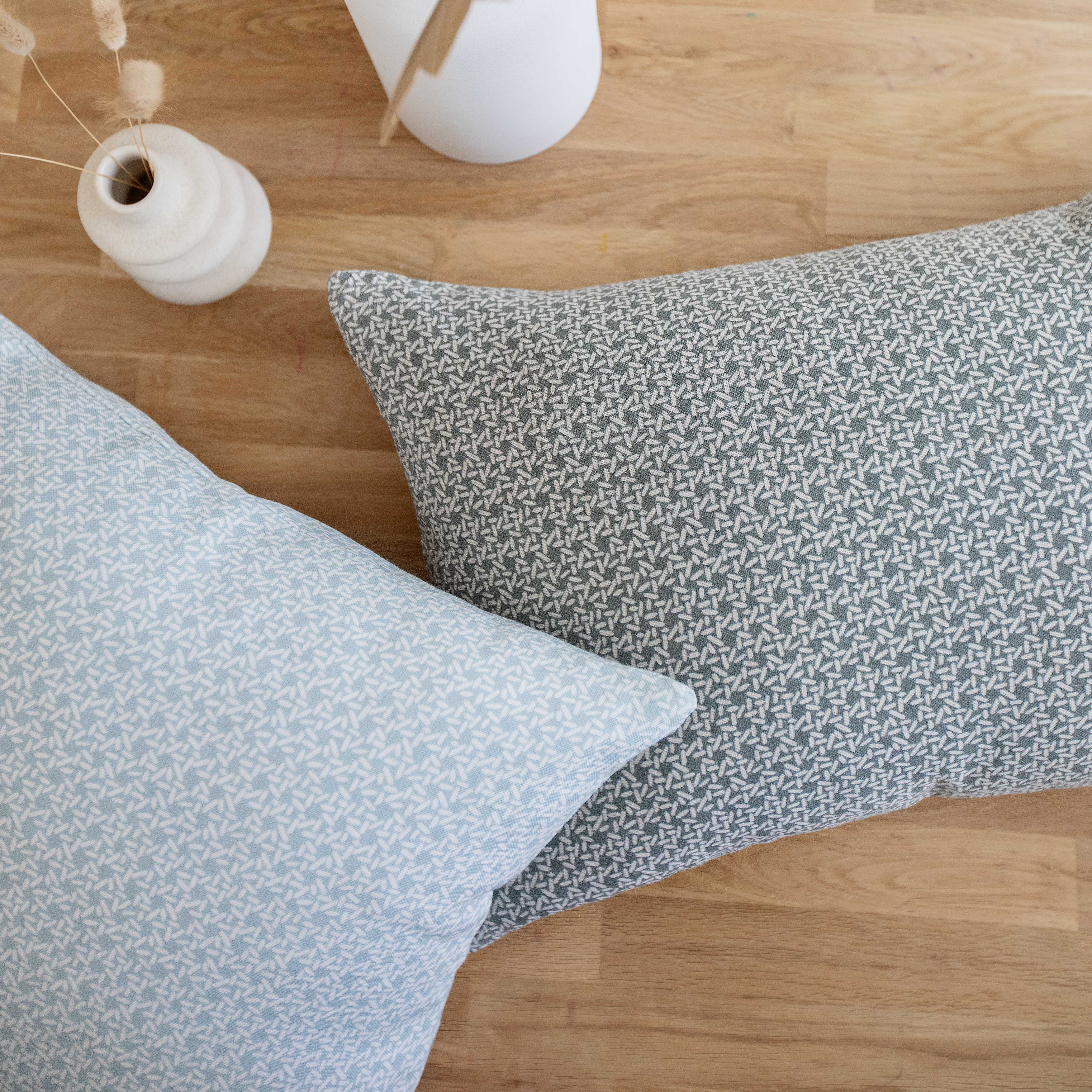 Carolina Rice pillow in Chambray styled by Emily Daws – placed on a vintage settee in a Charleston cottage