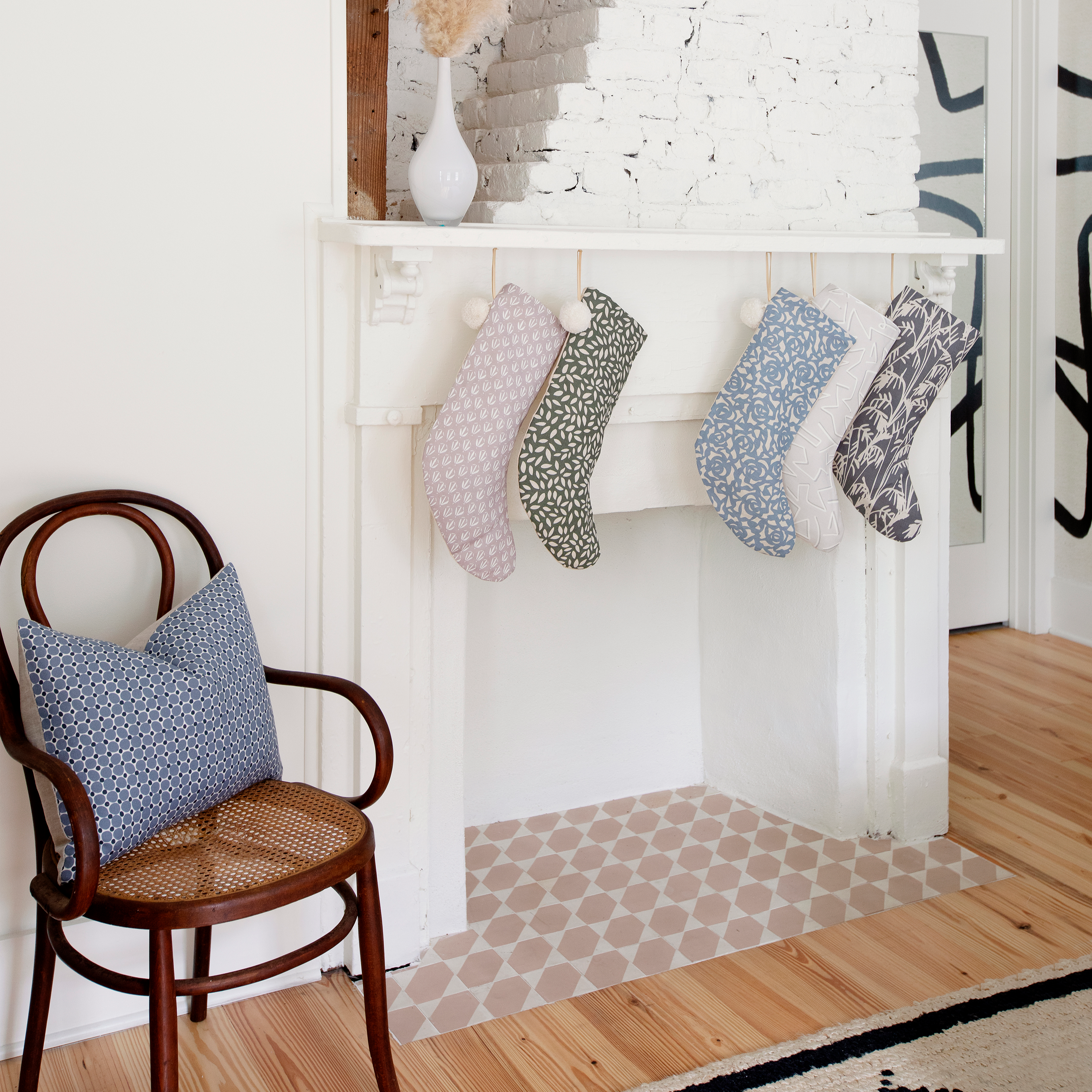 Cobblestone pillow in Ink styled by Emily Daws – featured on a porch or entry bench with natural textures