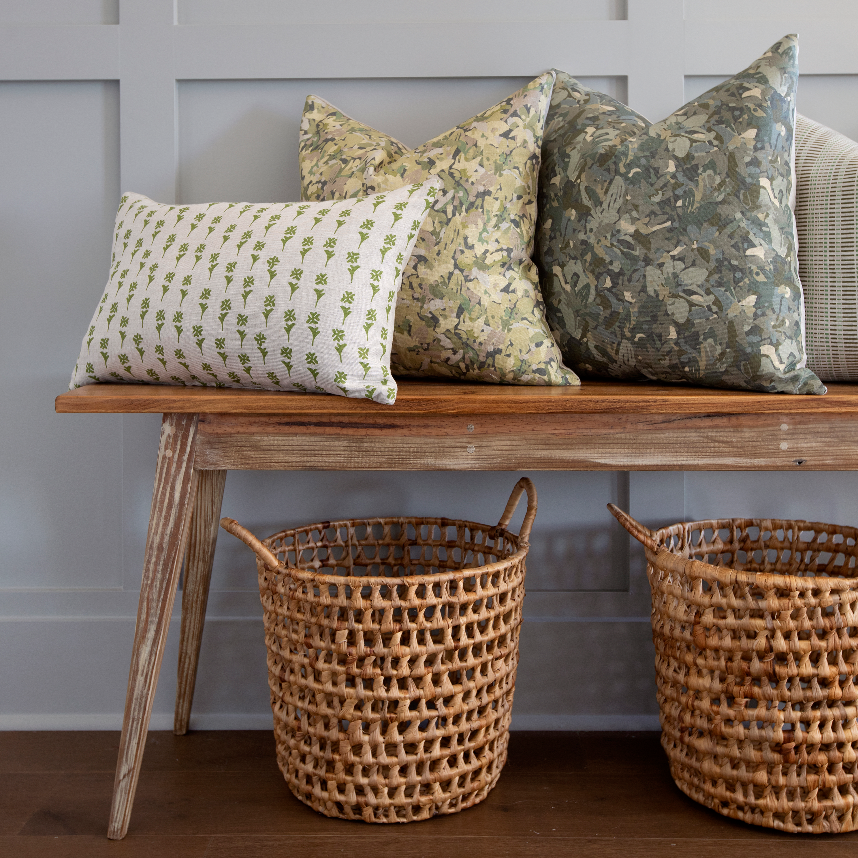 Daffodil pillow in Sprout styled by Emily Daws – layered with quilts in a woodland bedroom setting