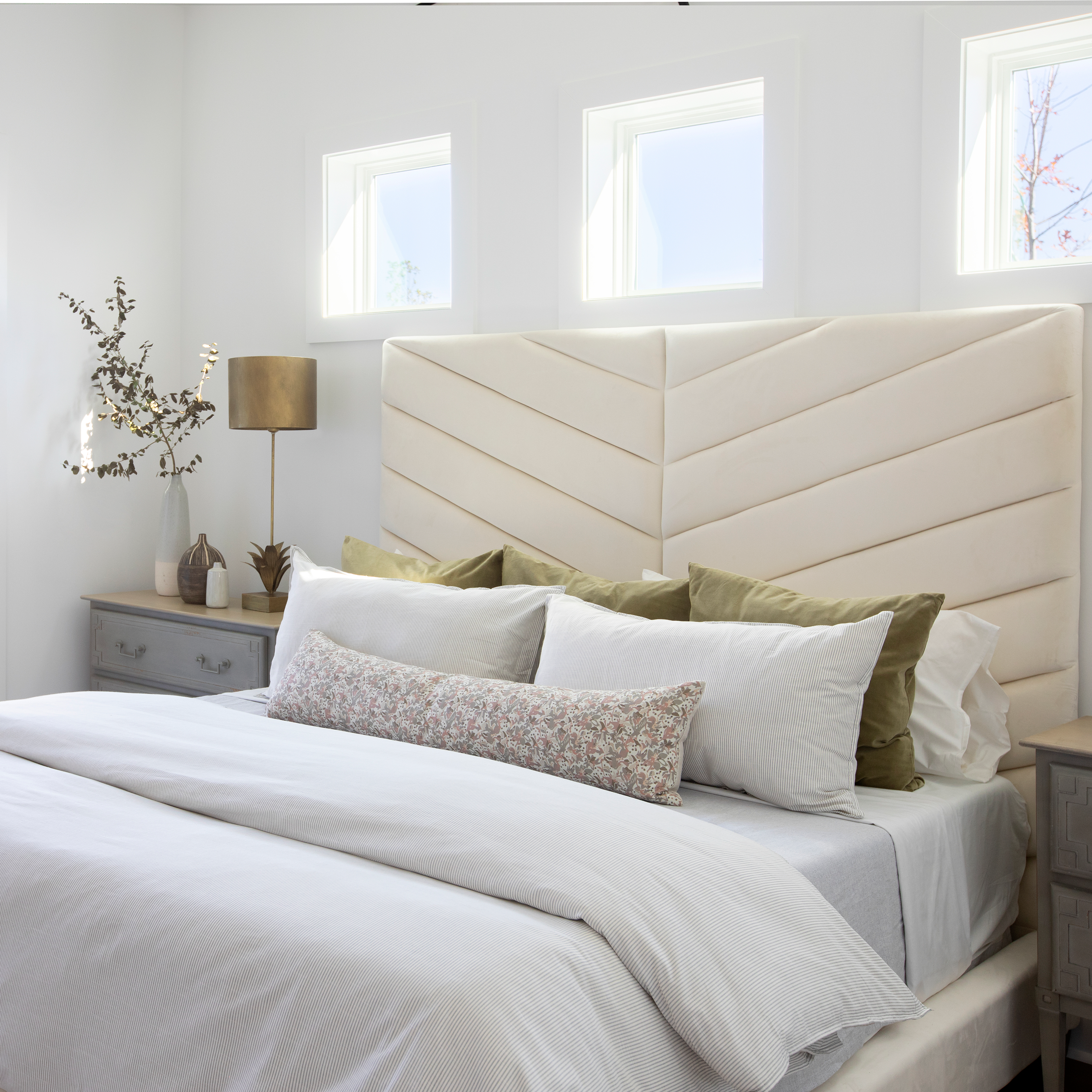 Eden pillow in Azaela styled by Emily Daws β layered with quilts in a woodland bedroom setting