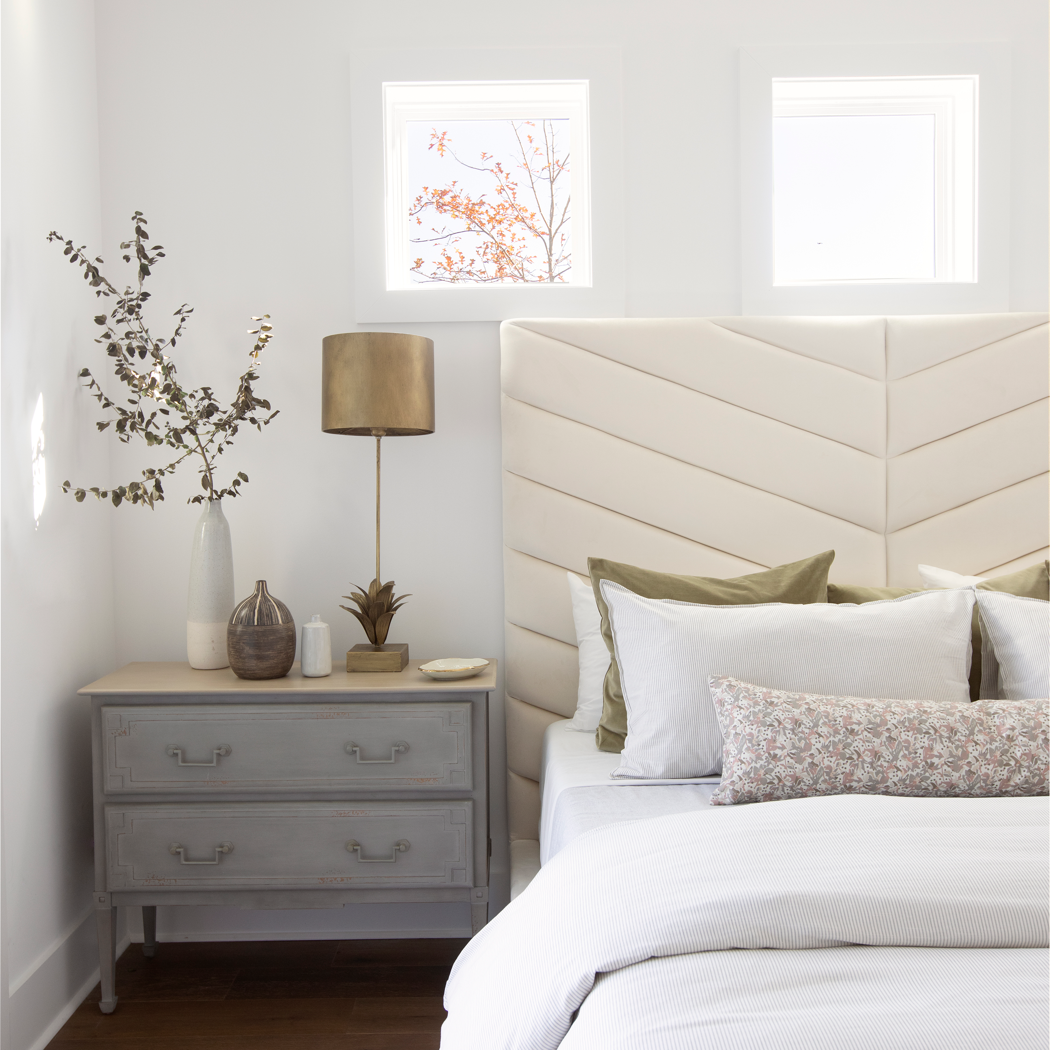 Decorative pillow in luxury fabric by Emily Daws, styled for modern Southern homes.