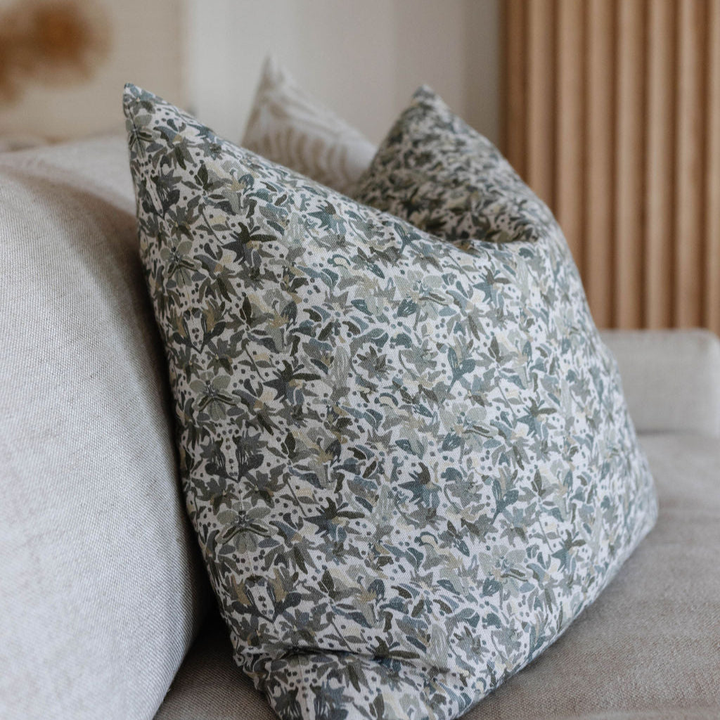 Eden pillow in Lichen styled by Emily Daws – layered with quilts in a woodland bedroom setting