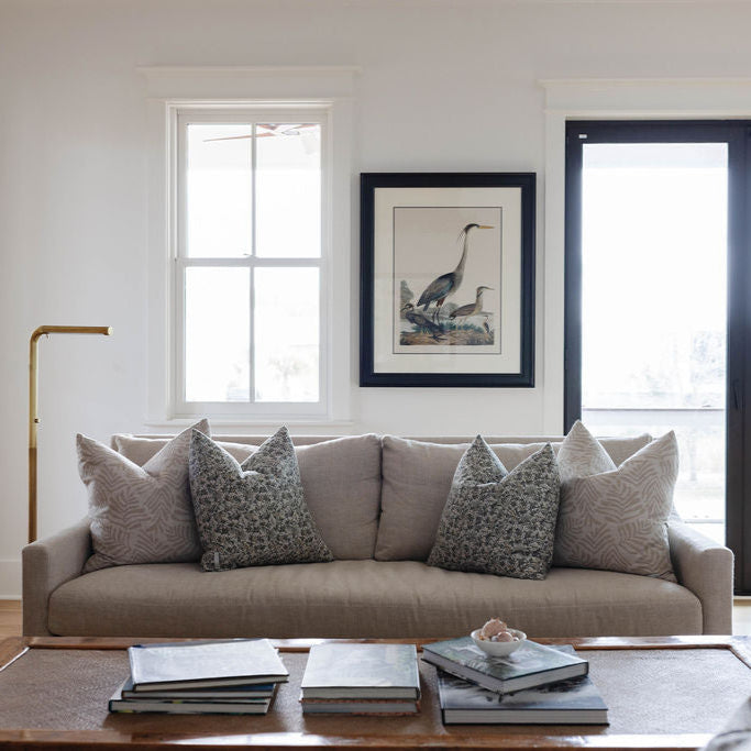 Eden pillow in Olive styled by Emily Daws – layered with quilts in a woodland bedroom setting