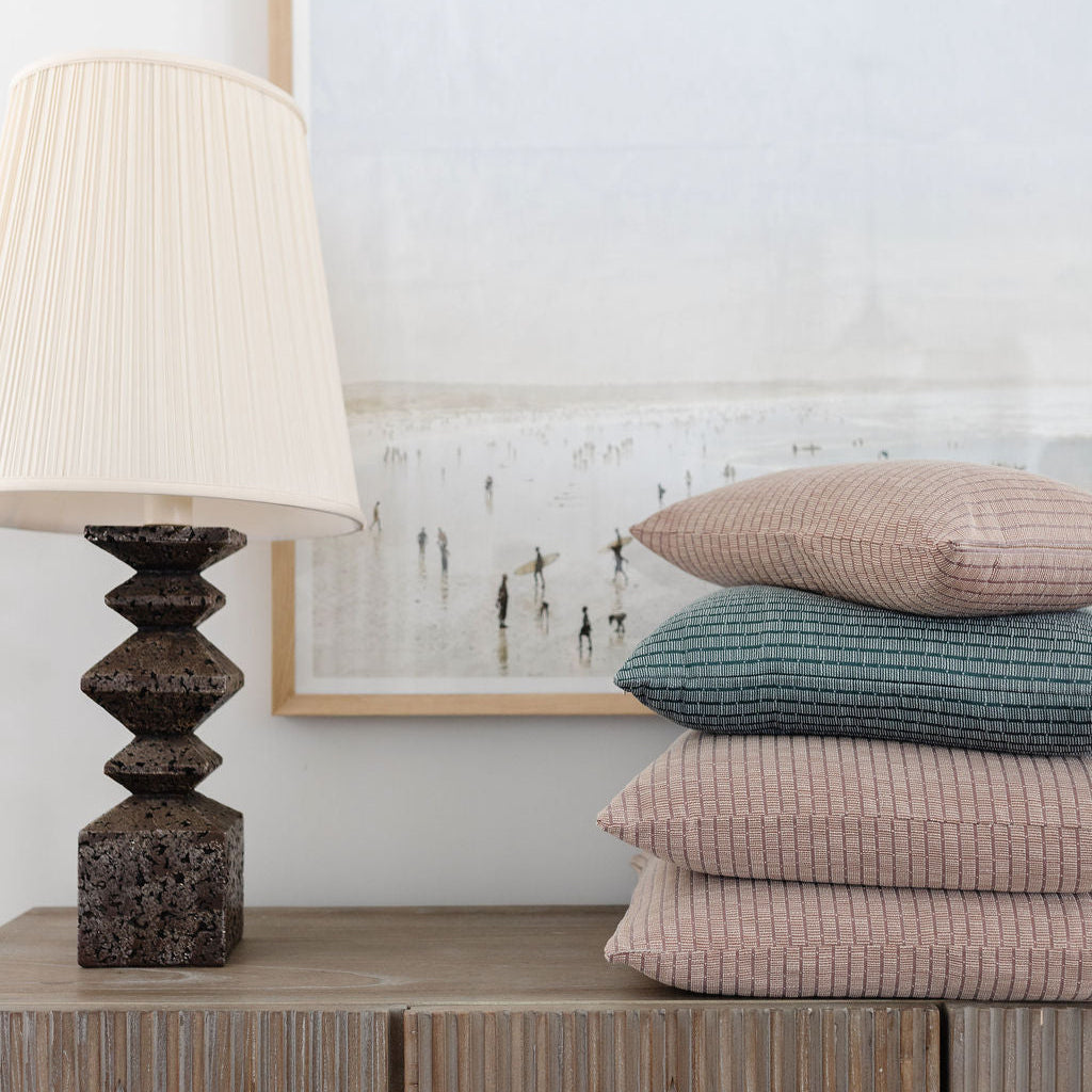 Emily Daws luxury woven pillows in Jetty Punch stacked. Small batch fabrics made in the South for bespoke pillows, upholstery, and drapery