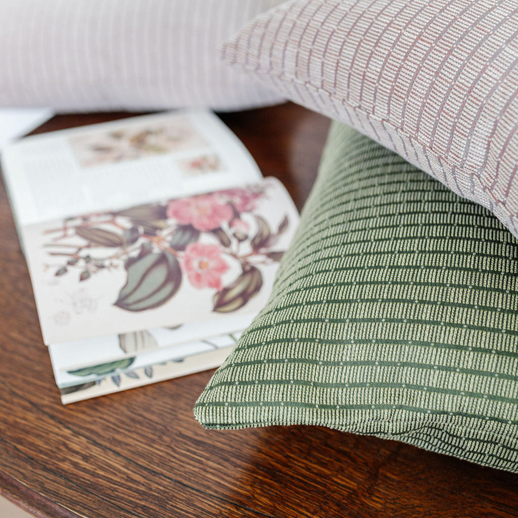 Emily Daws Jetty pillows stacked, boutique fabrics for bespoke interiors and luxury home styling.
