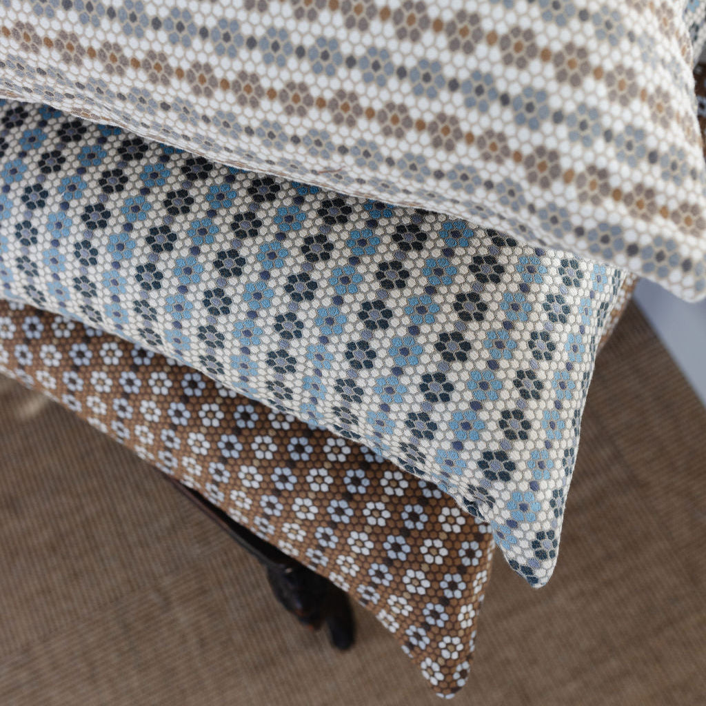 Woven accent pillows by Emily Daws, designed for cozy spaces and bespoke interiors.