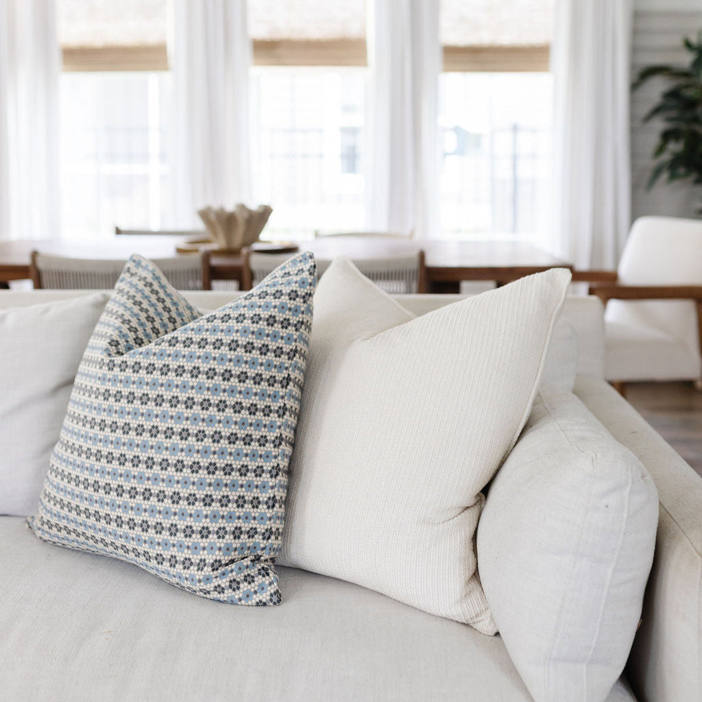 Close up styled sofa with Emily Daws pillows in small-batch woven fabrics, designed for interior designers and bespoke interiors.