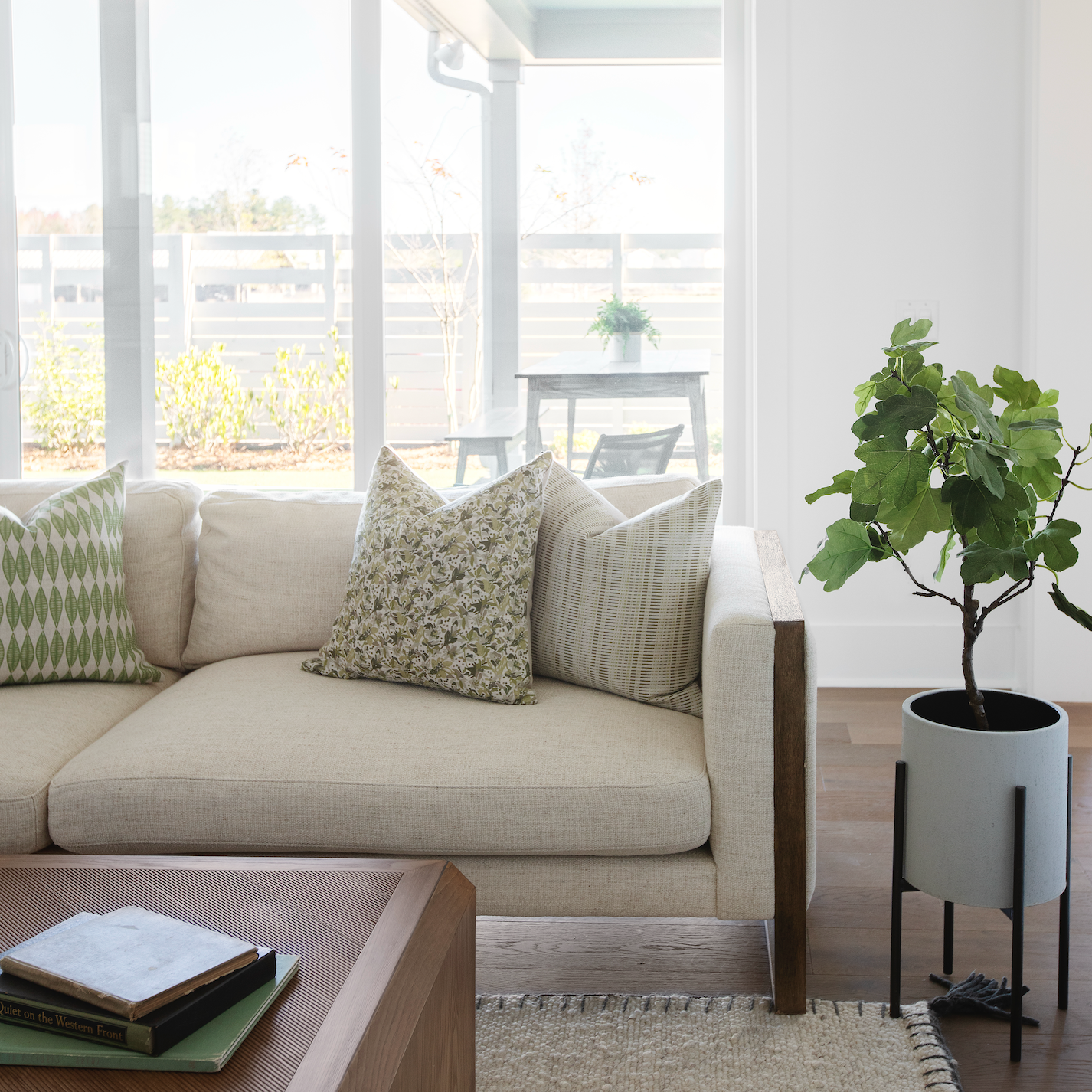 Emily Daws pillows styled in a living room with layered fabrics and patterns, designed for luxury interiors.