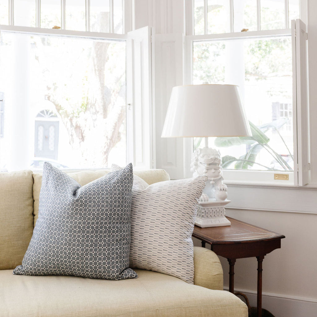 Styled sofa with Emily Daws pillows in small-batch fabrics, designed for interior designers and bespoke interiors.