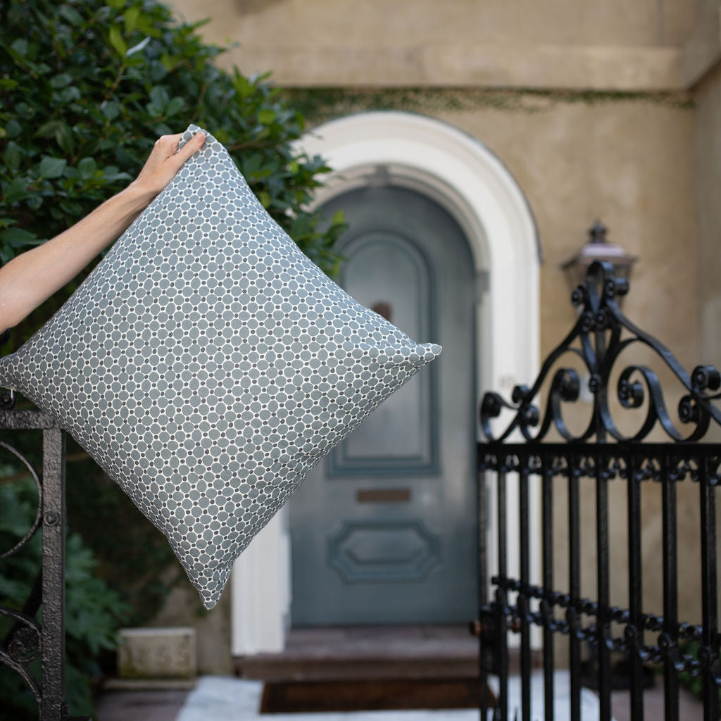 Single throw pillow by Emily Daws in storied Southern-inspired pattern.
