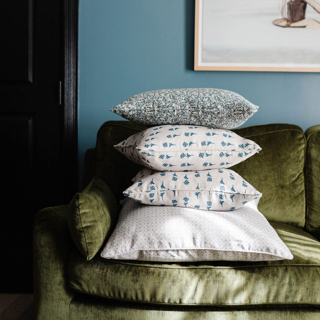 Styled sofa with Emily Daws pillows in small-batch fabrics, designed for interior designers and bespoke interiors.