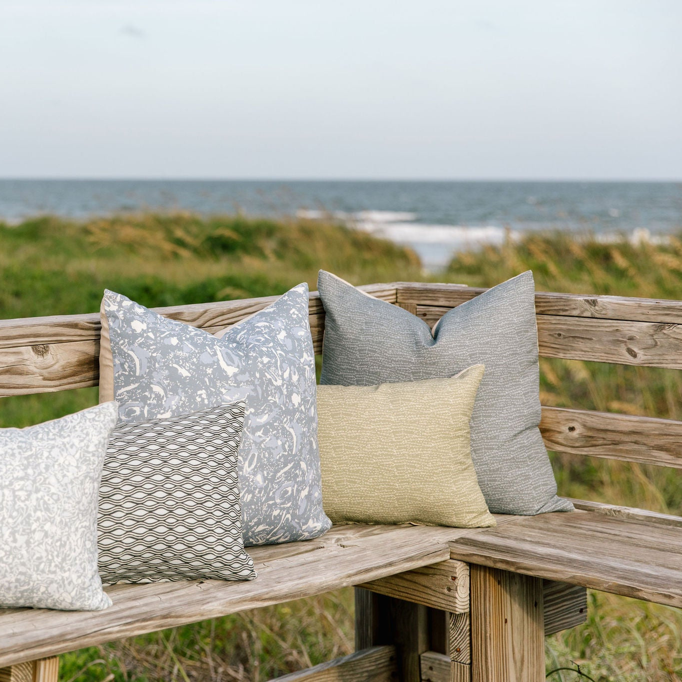 Bench seating styled with Emily Daws pillows in Belgian linen fabrics, created for trade professionals and clients.