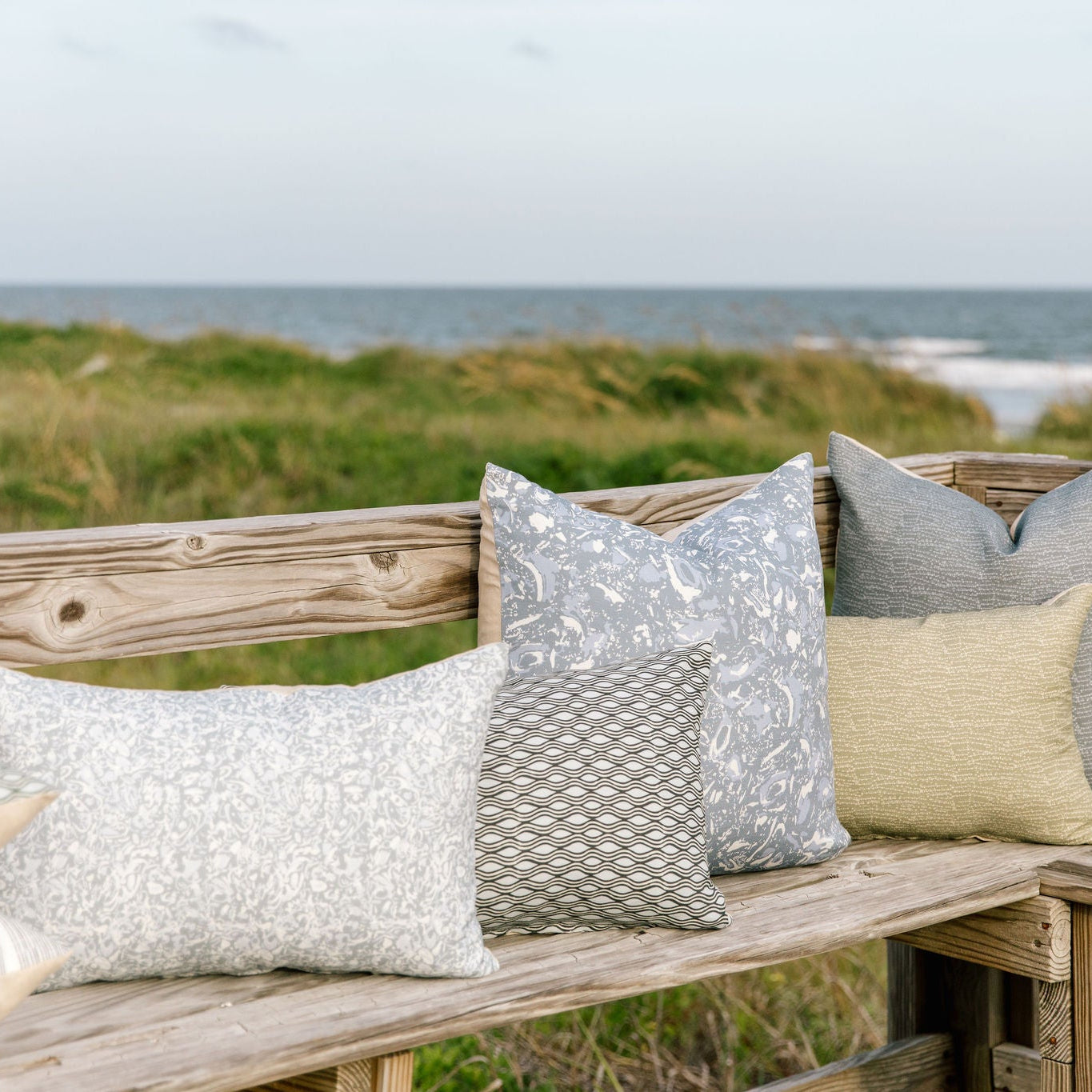 Bench seating styled with Emily Daws pillows in Belgian linen fabrics, created for trade professionals and clients.