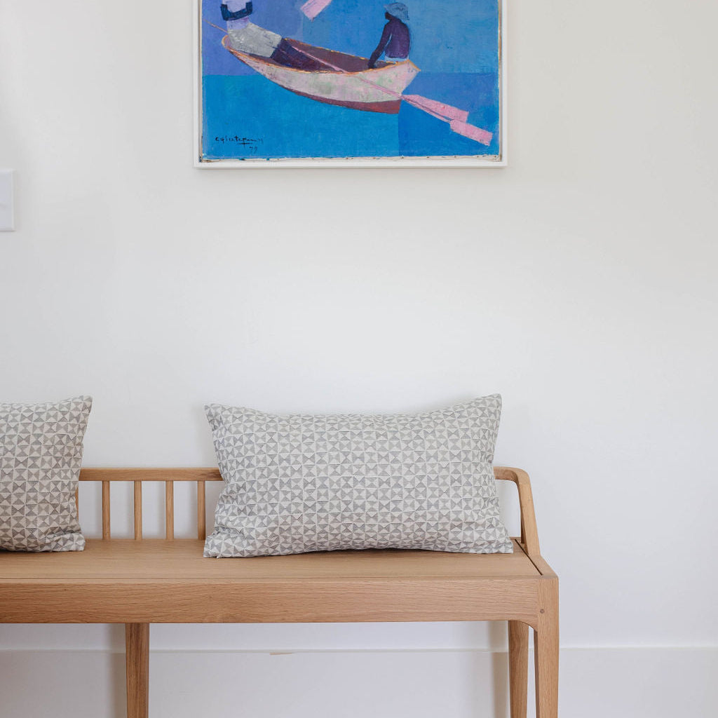 Bench seating styled with Emily Daws pillows in Belgian linen fabrics, created for trade professionals and clients.