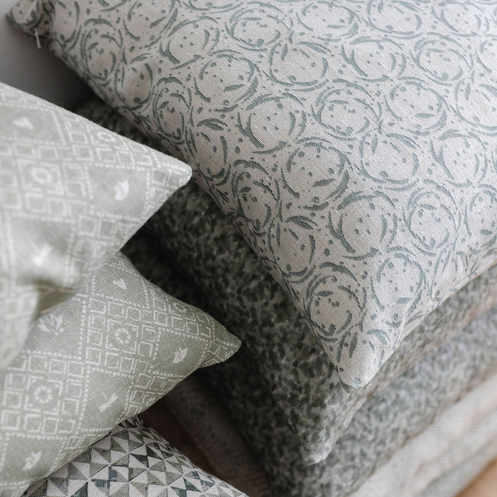 Decorative pillow grouping by Emily Daws featuring small-batch fabrics and Southern-inspired design details.