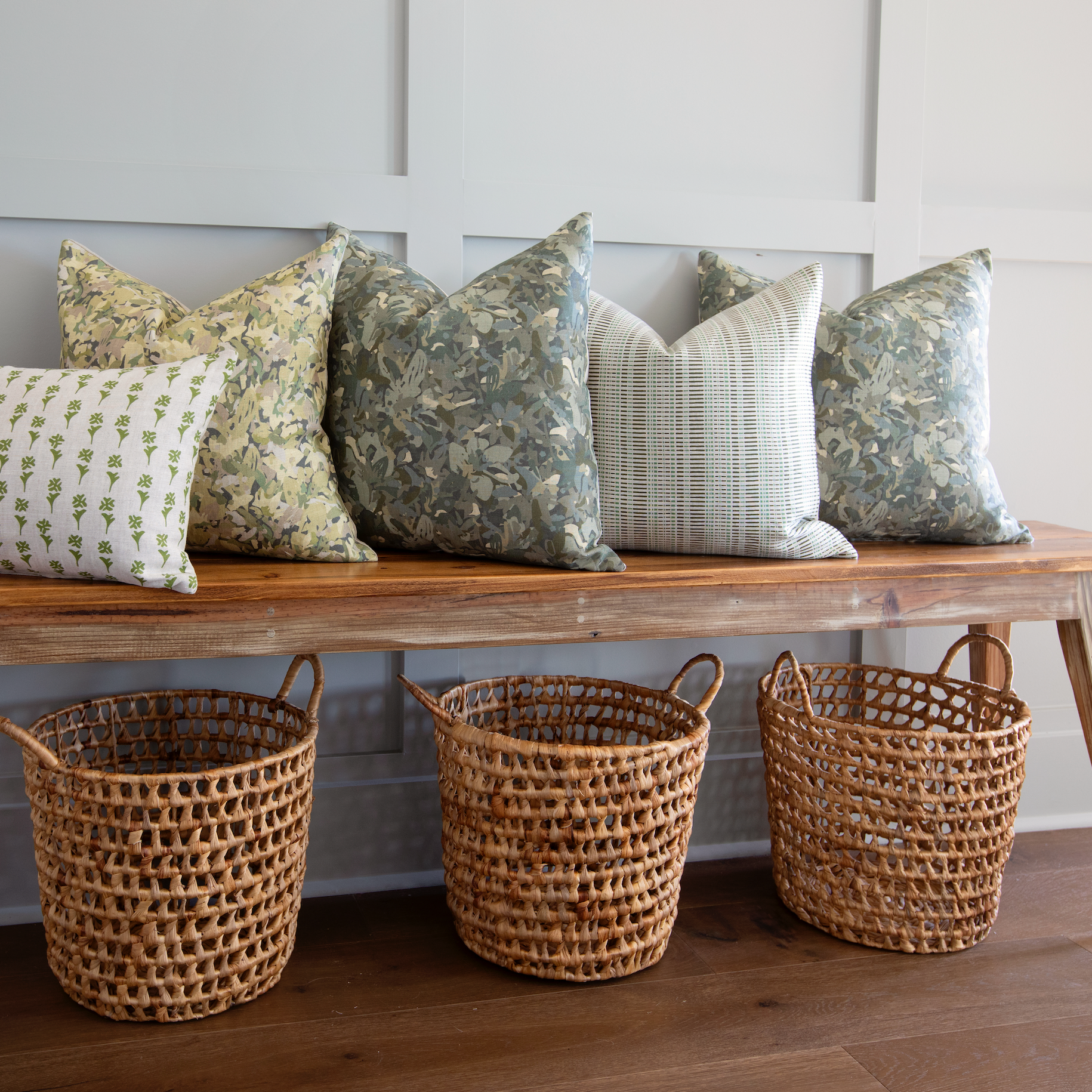 Bench seating styled with Emily Daws pillows in Belgian linen fabrics, created for trade professionals and clients.