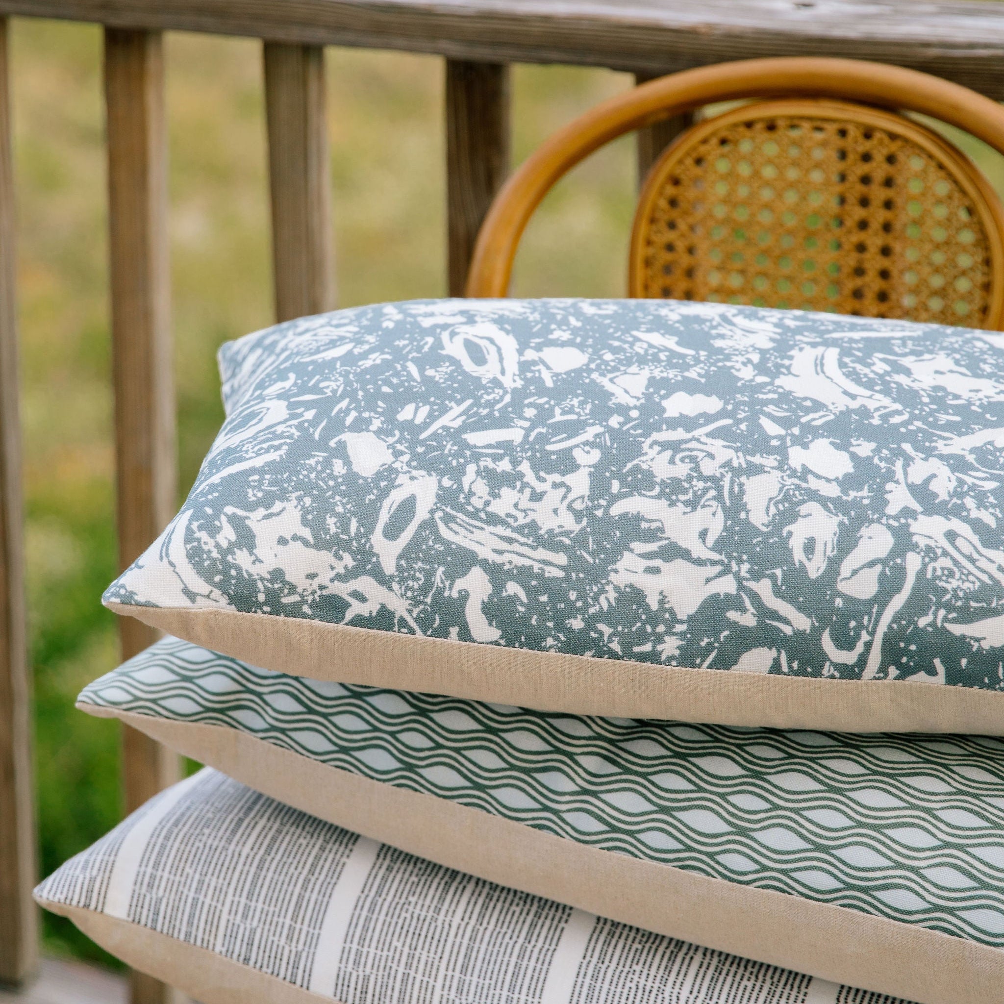 Emily Daws pillows styled in layered tones and textures, crafted for Southern-inspired interiors and cozy spaces.