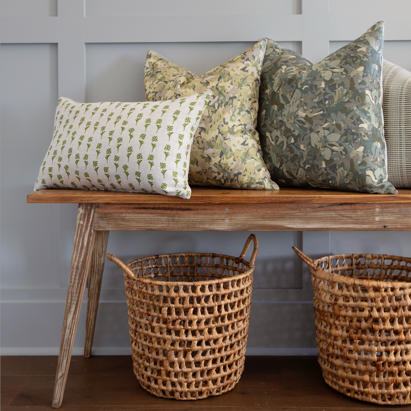 Bench seating styled with Emily Daws pillows in Belgian linen fabrics, created for trade professionals and clients.