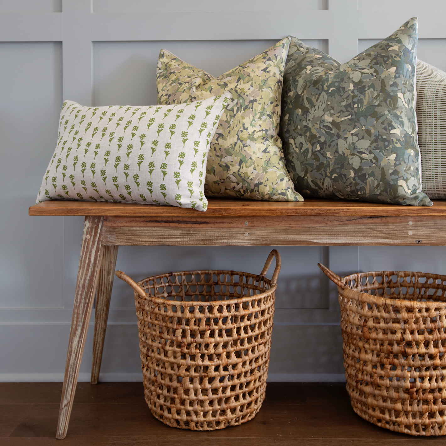 Bench seating styled with Emily Daws pillows in Belgian linen fabrics, created for trade professionals and clients.