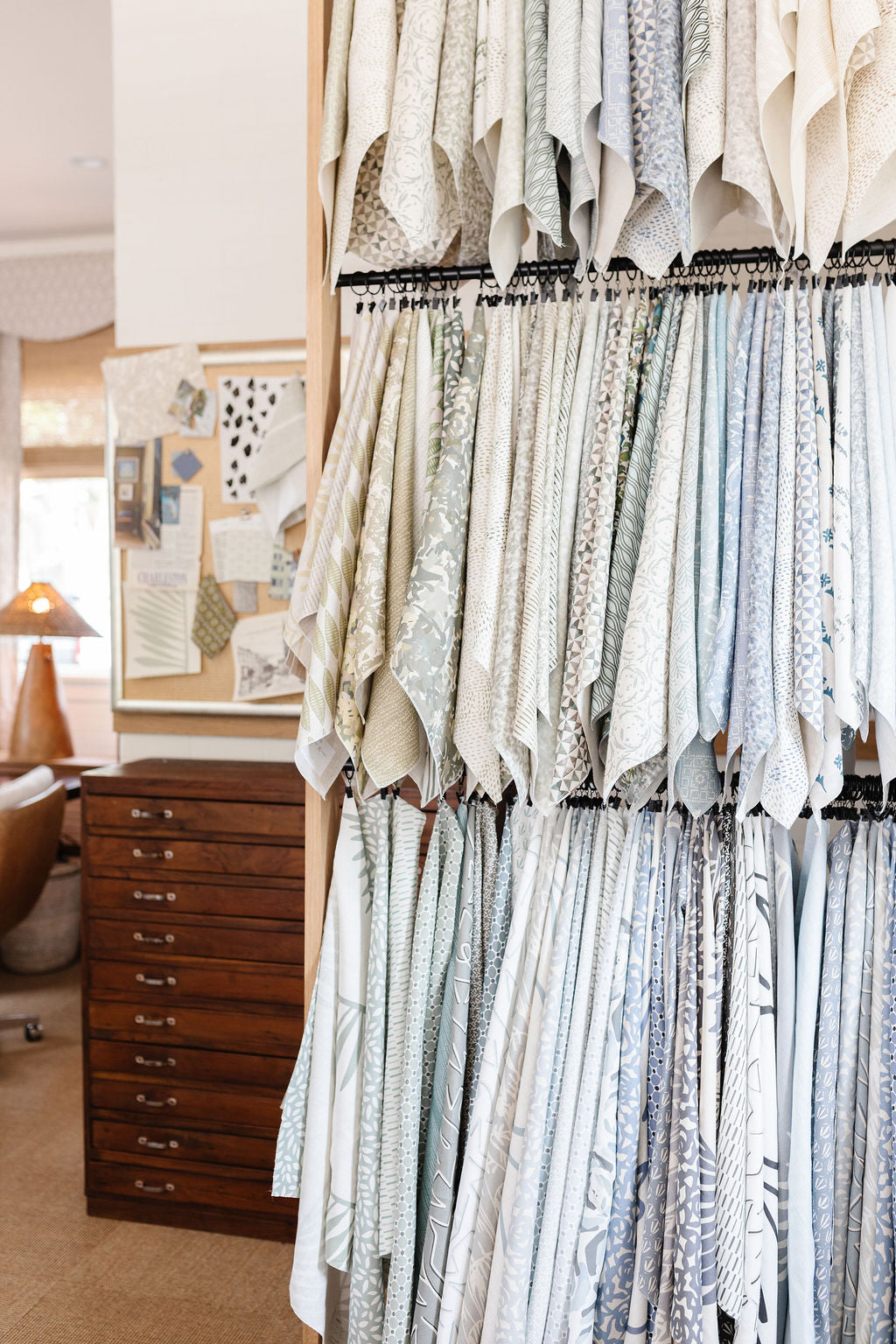 Southern-inspired linen fabric swatches hanging in showroom