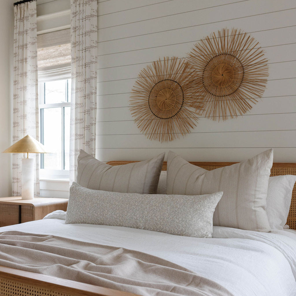 Estuary pillow in Drift styled by Emily Daws – shown on a porch bench with other woven accents