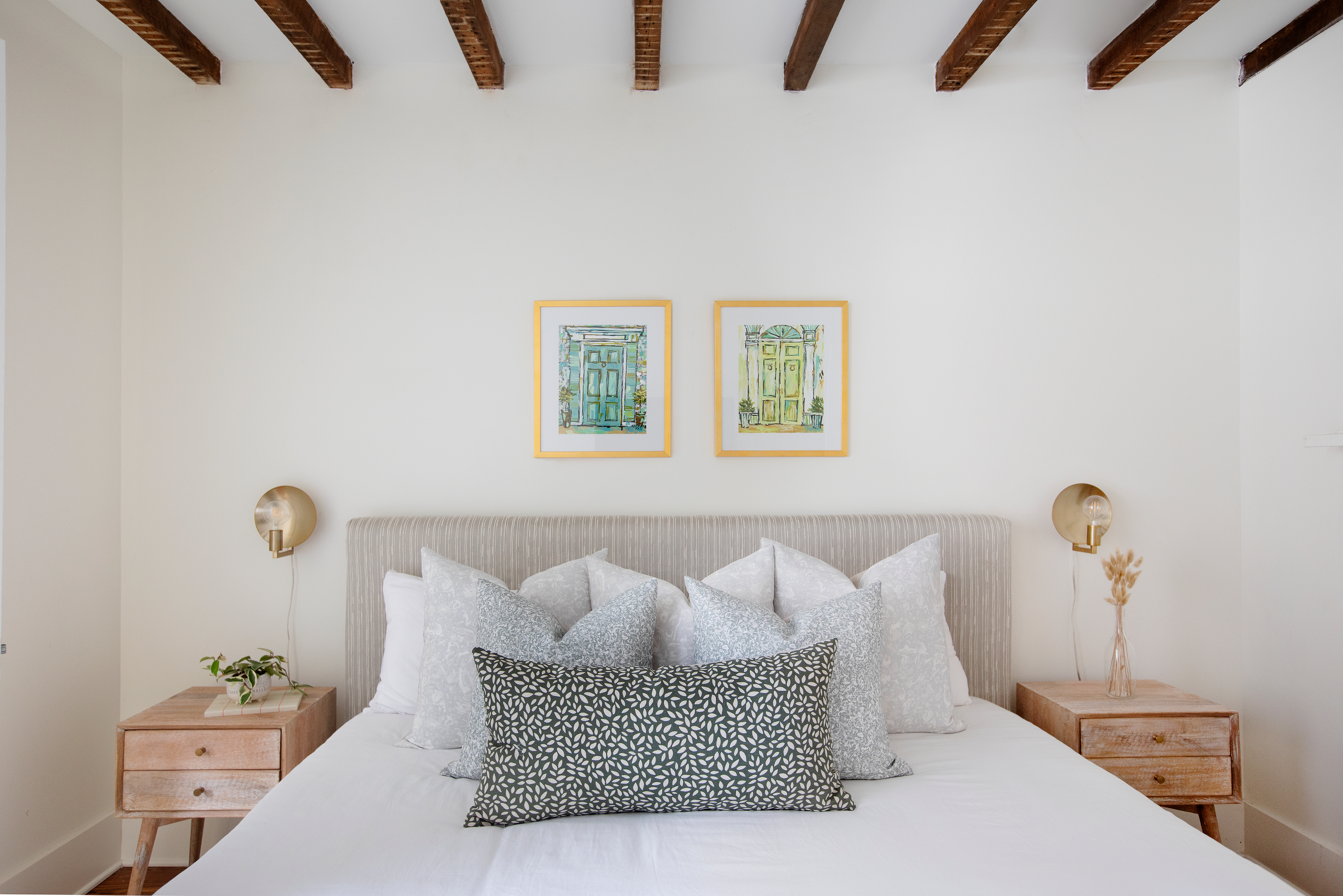 Estuary pillow in Artichoke styled by Emily Daws – shown on a porch bench with other woven accents