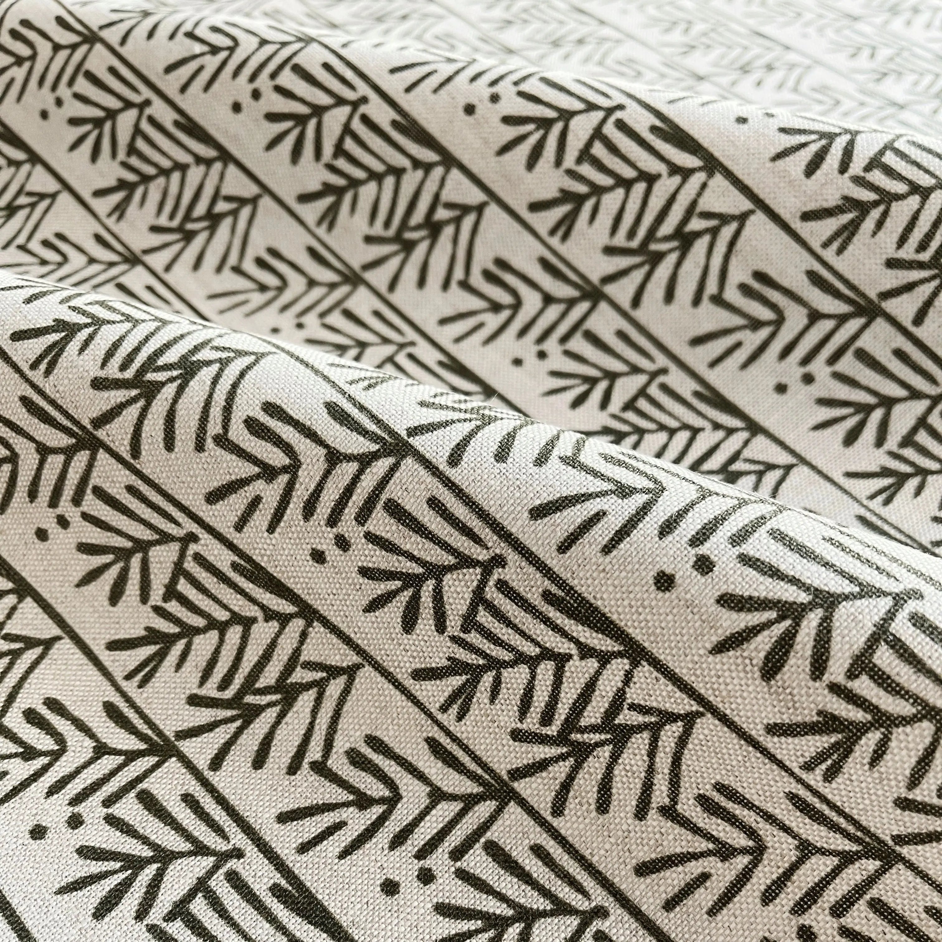 Hemlock Holly pillow by Emily Daws styled in an interior — Flora Collection