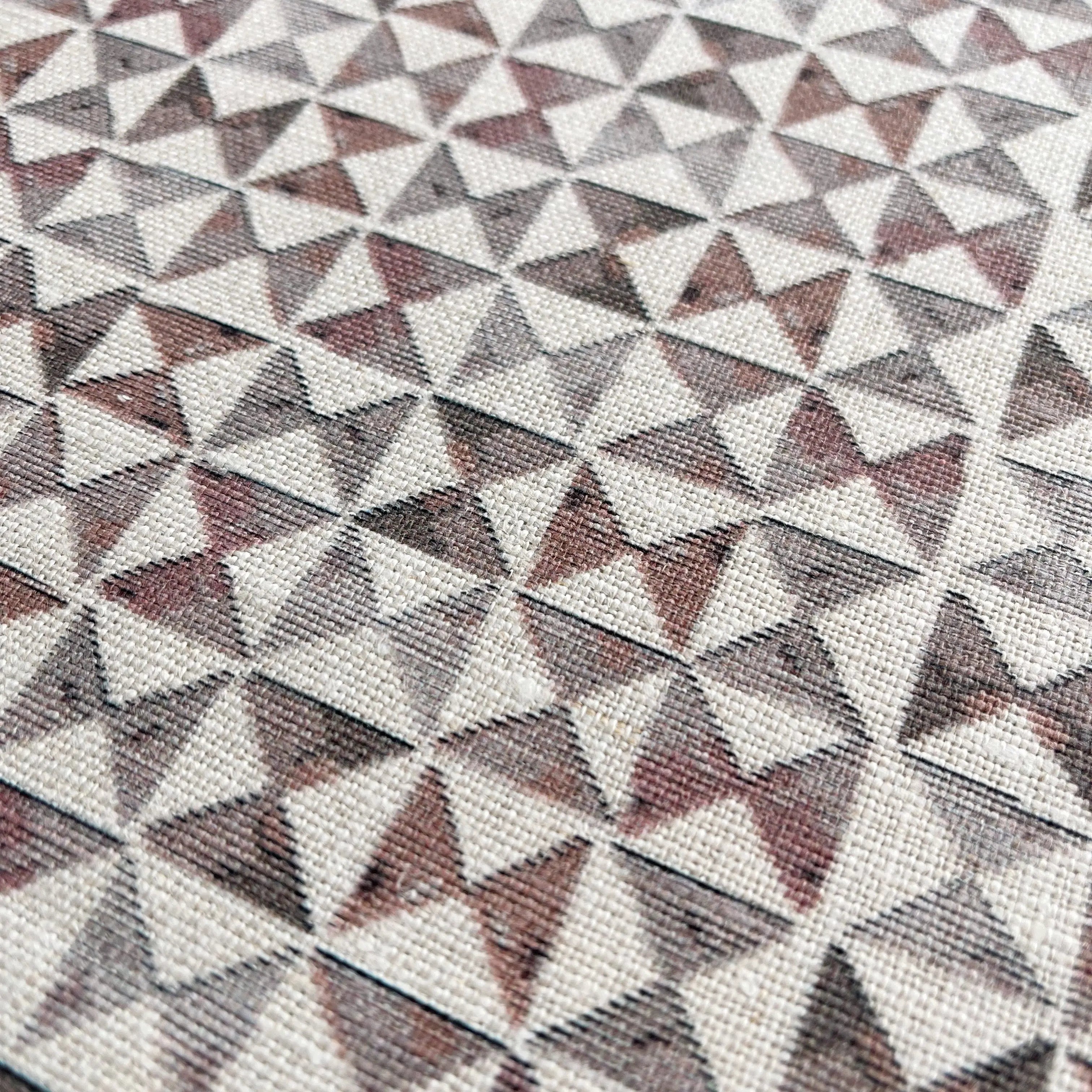 Kaleidoscope fabric in Cranberry by Emily Daws β close-up detail of Belgian linen, Fauna Collection