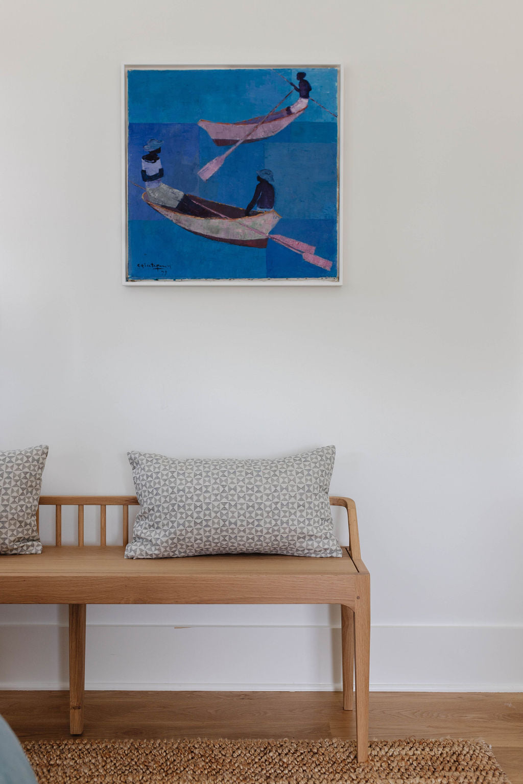 Kaleidoscope pillow in Cashmere styled by Emily Daws – shown on a rustic bench with handmade quilts