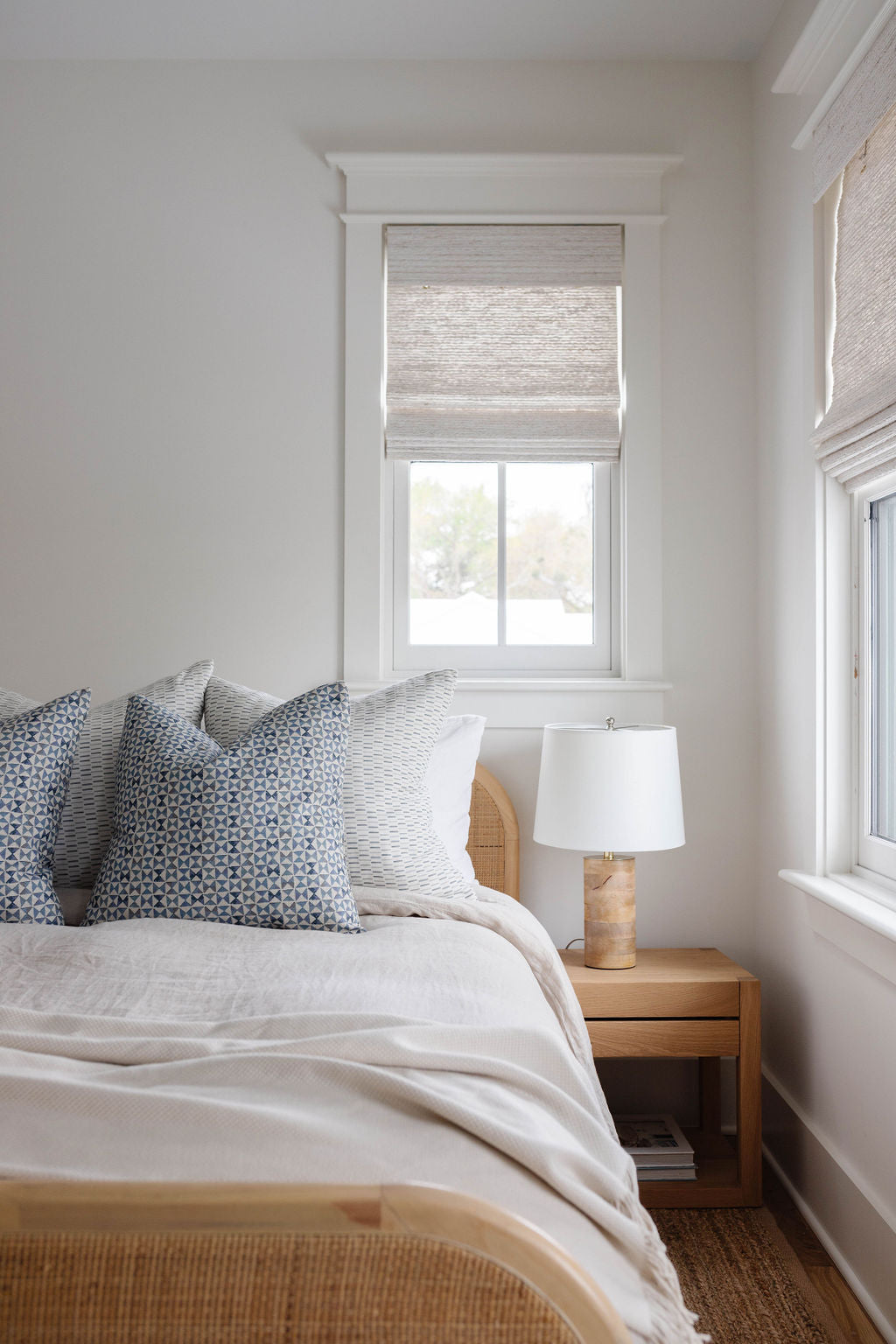 Kaleidoscope pillow in Iris styled by Emily Daws – shown on a rustic bench with handmade quilts