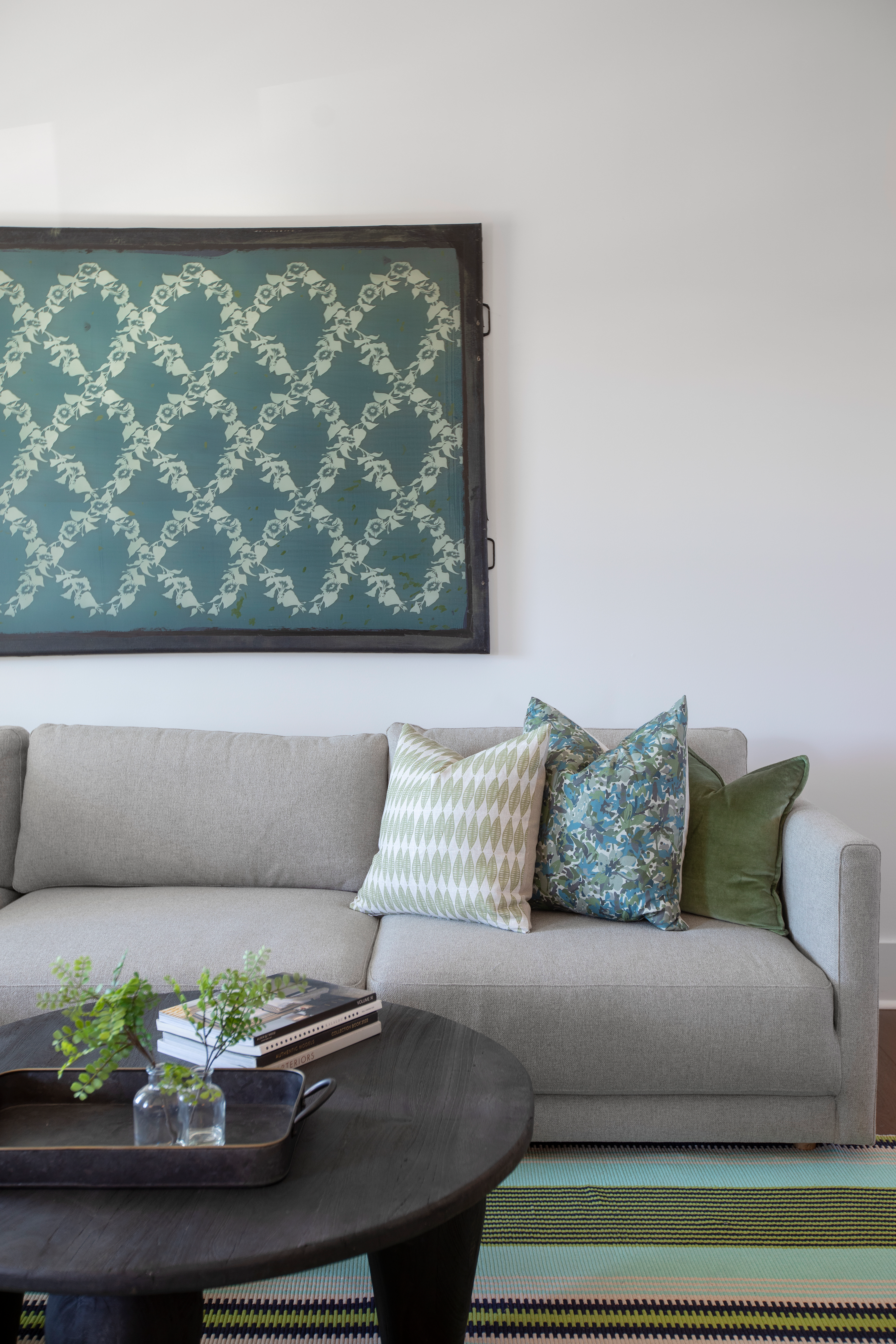 Leaflette pillow in Peridot styled by Emily Daws – layered with quilts in a woodland bedroom setting
