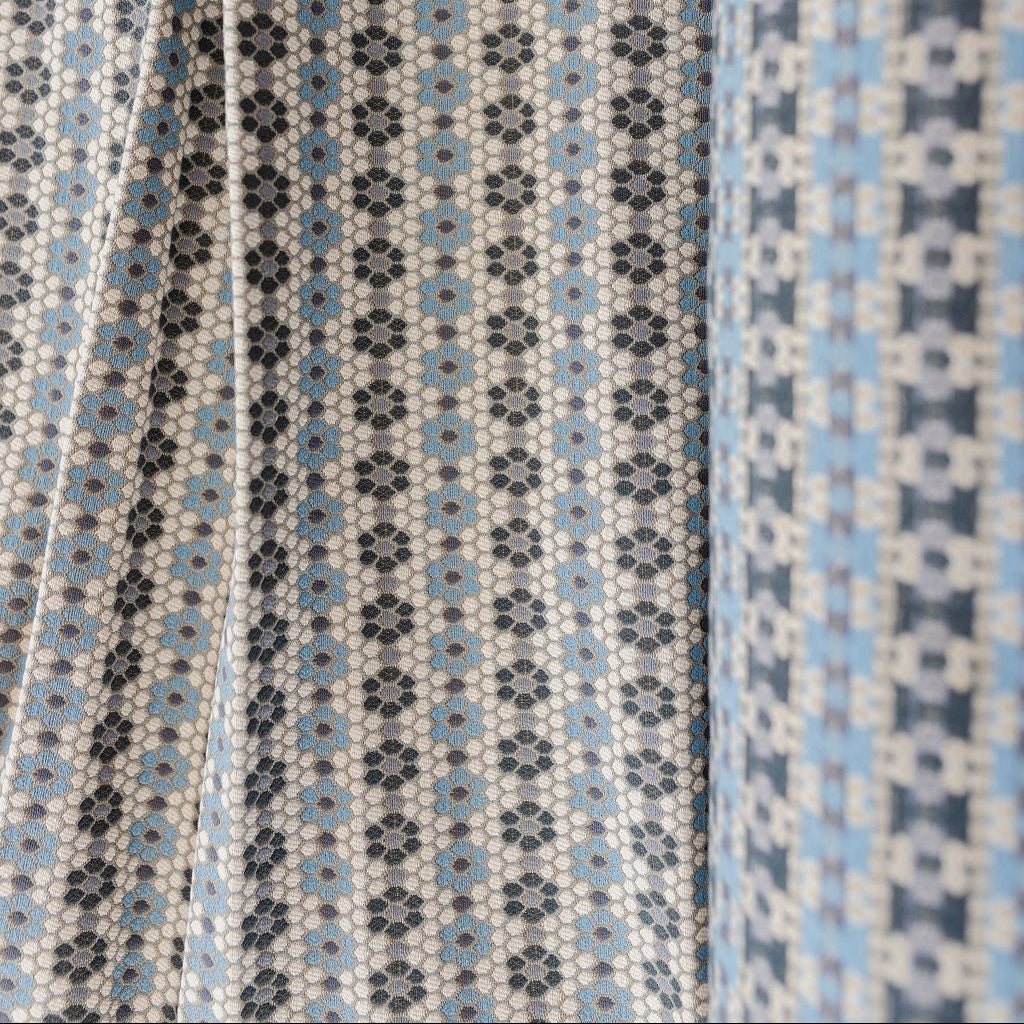 Nectar fabric in Cerulean Blue – close-up of texture and animal or insect pattern; ideal for pillows