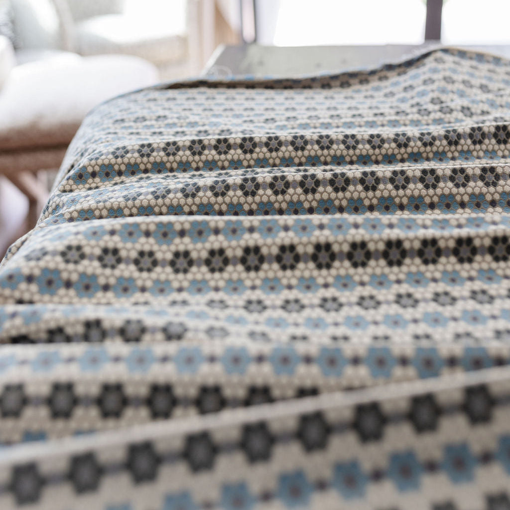 Nectar fabric in Cerulean Blue – close-up of texture and animal or insect pattern; ideal for pillows