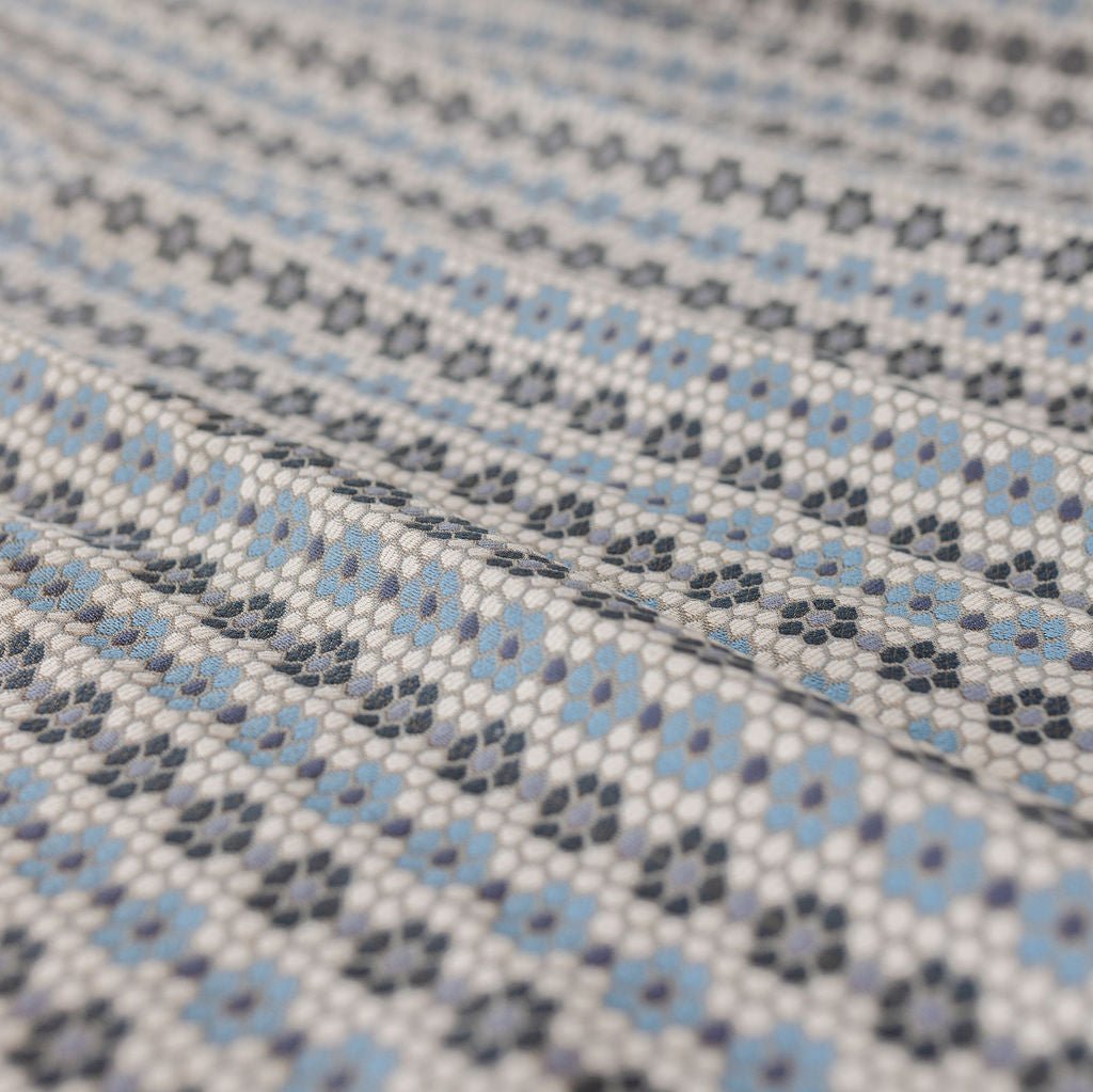 Nectar fabric in Cerulean Blue – close-up of texture and animal or insect pattern; ideal for pillows