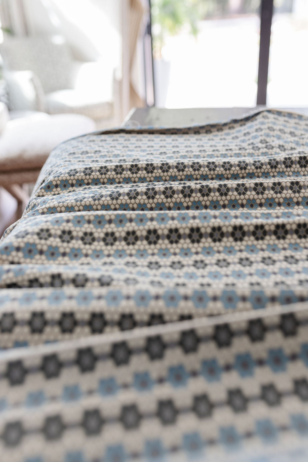 Nectar fabric in Cerulean Blue – close-up of texture and animal or insect pattern; ideal for pillows
