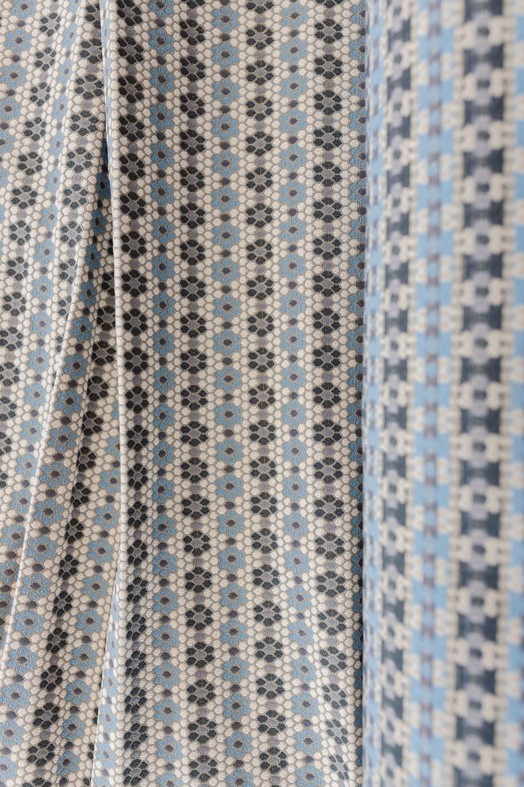 Nectar fabric in Cerulean Blue – close-up of texture and animal or insect pattern; ideal for pillows