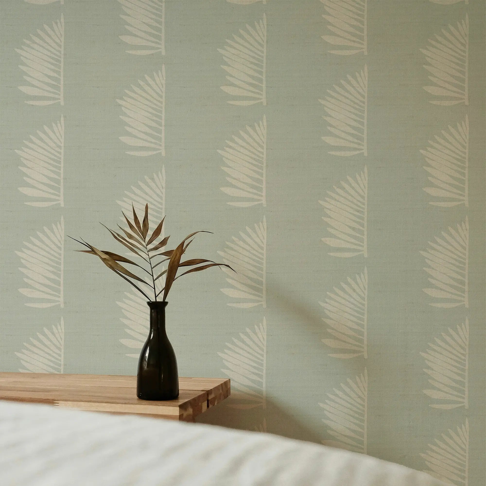 Palmetto Grasscloth wallpaper in Haint Blue styled by Emily Daws – shown in a Charleston home entryway