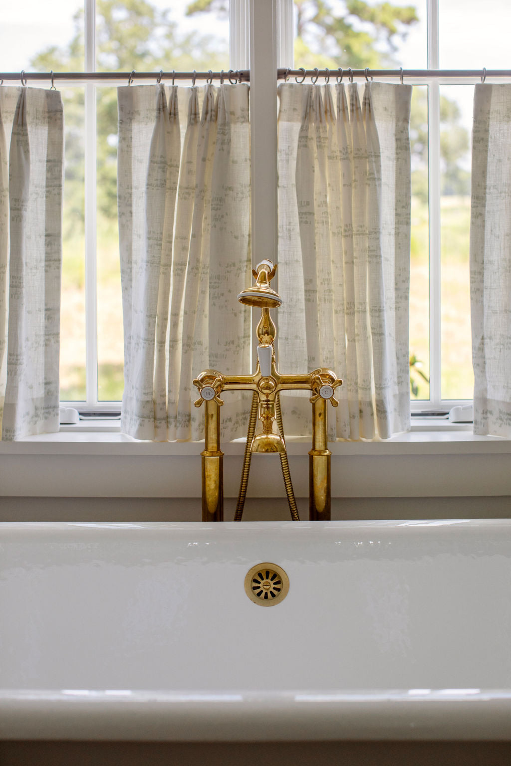 Salt Marsh fabric in Laurel by Emily Daws – styled in a Charleston coastal home; perfect for pillows, window treatments, or accent upholstery – Waterways fabric collection; Charleston luxury fabric by the yard for interiors and coastal homes
