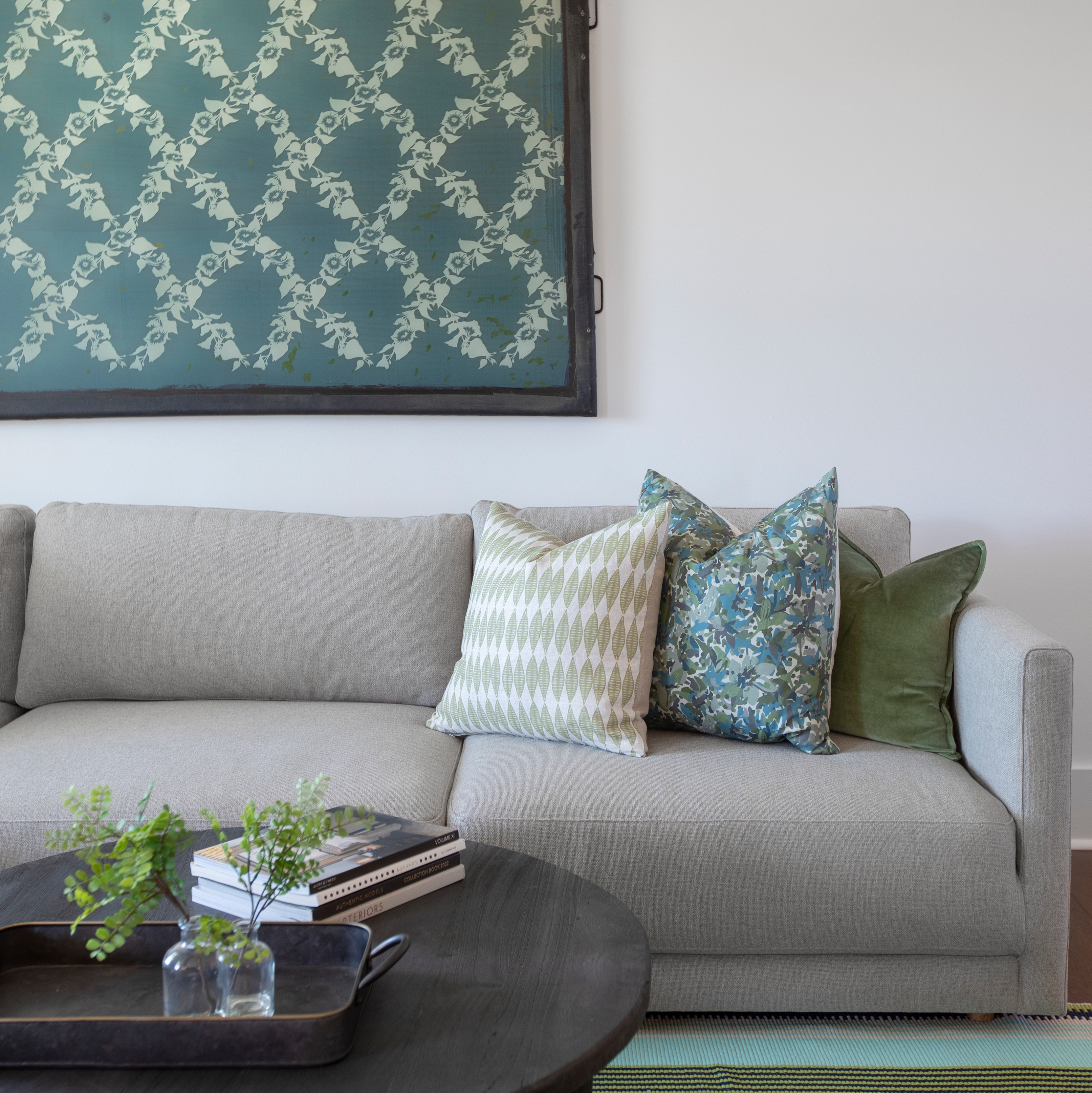 Leaflette pillow in Peridot styled by Emily Daws – layered with quilts in a woodland bedroom setting