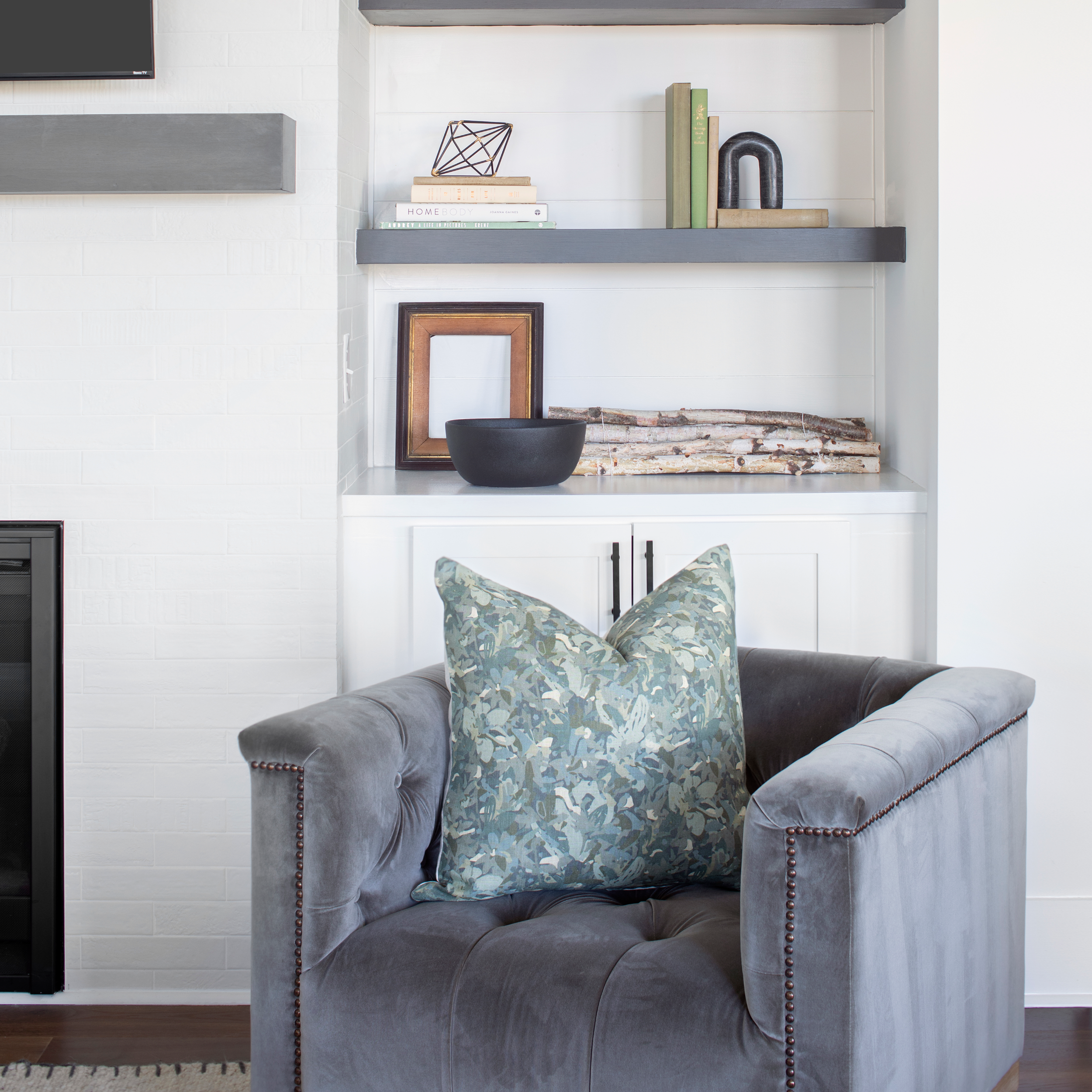Thicket pillow in Shale styled by Emily Daws – layered with quilts in a woodland bedroom setting