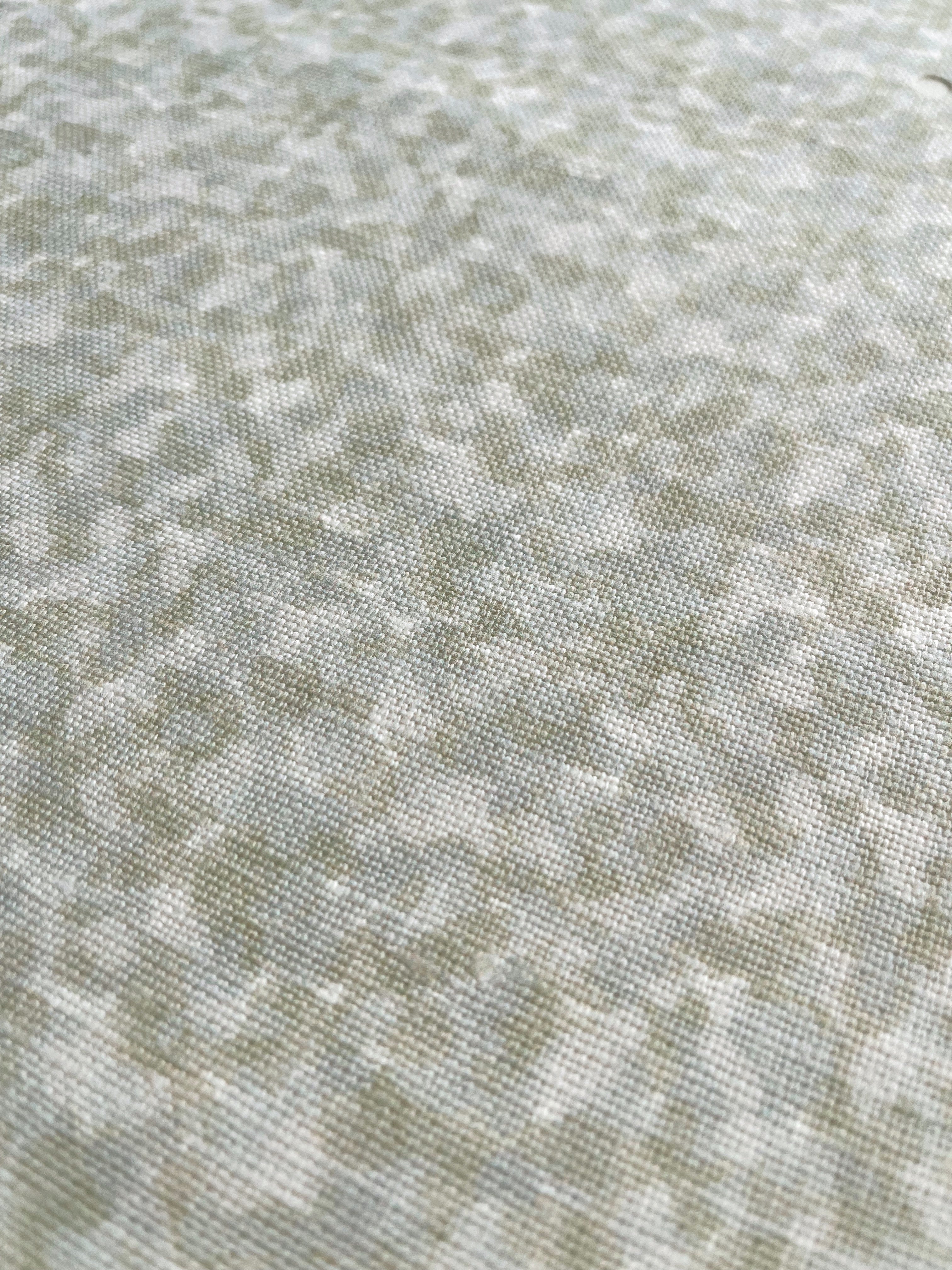 Tortoise pillow in Honeydew – close-up of natural linen and pattern from the Fauna Collection