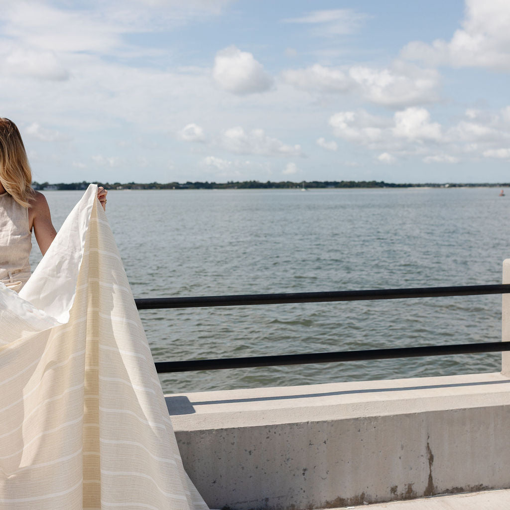 View of Emily Daws Sandbar fabric by the yard with the Charleston harbor in the background on a sunny day.