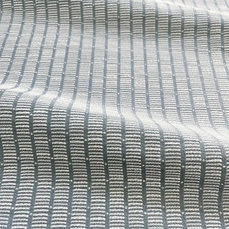 Jetty Cooper Blue pillow by Emily Daws styled in an interior — Waterways Collection