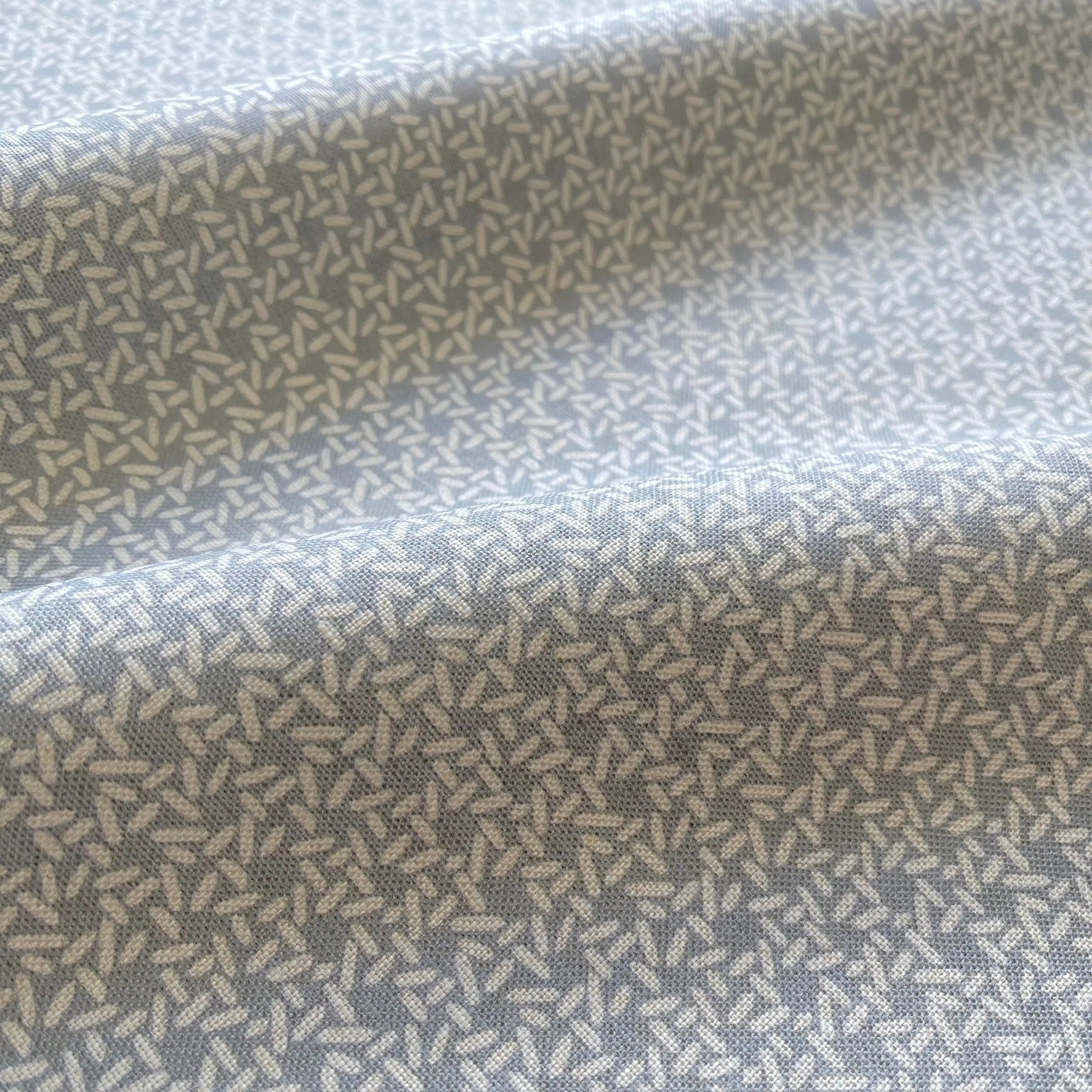 Carolina Rice Chambray pillow by Emily Daws styled in an interior — Charleston Collection