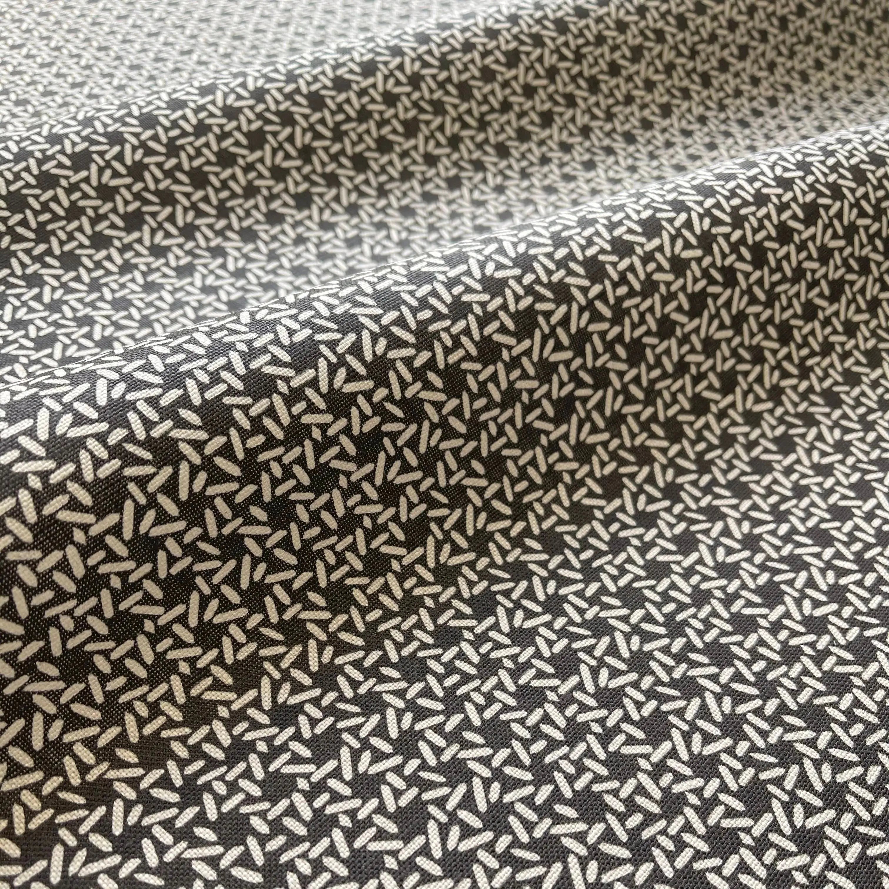 Carolina Rice Onyx pillow by Emily Daws styled in an interior — Charleston Collection
