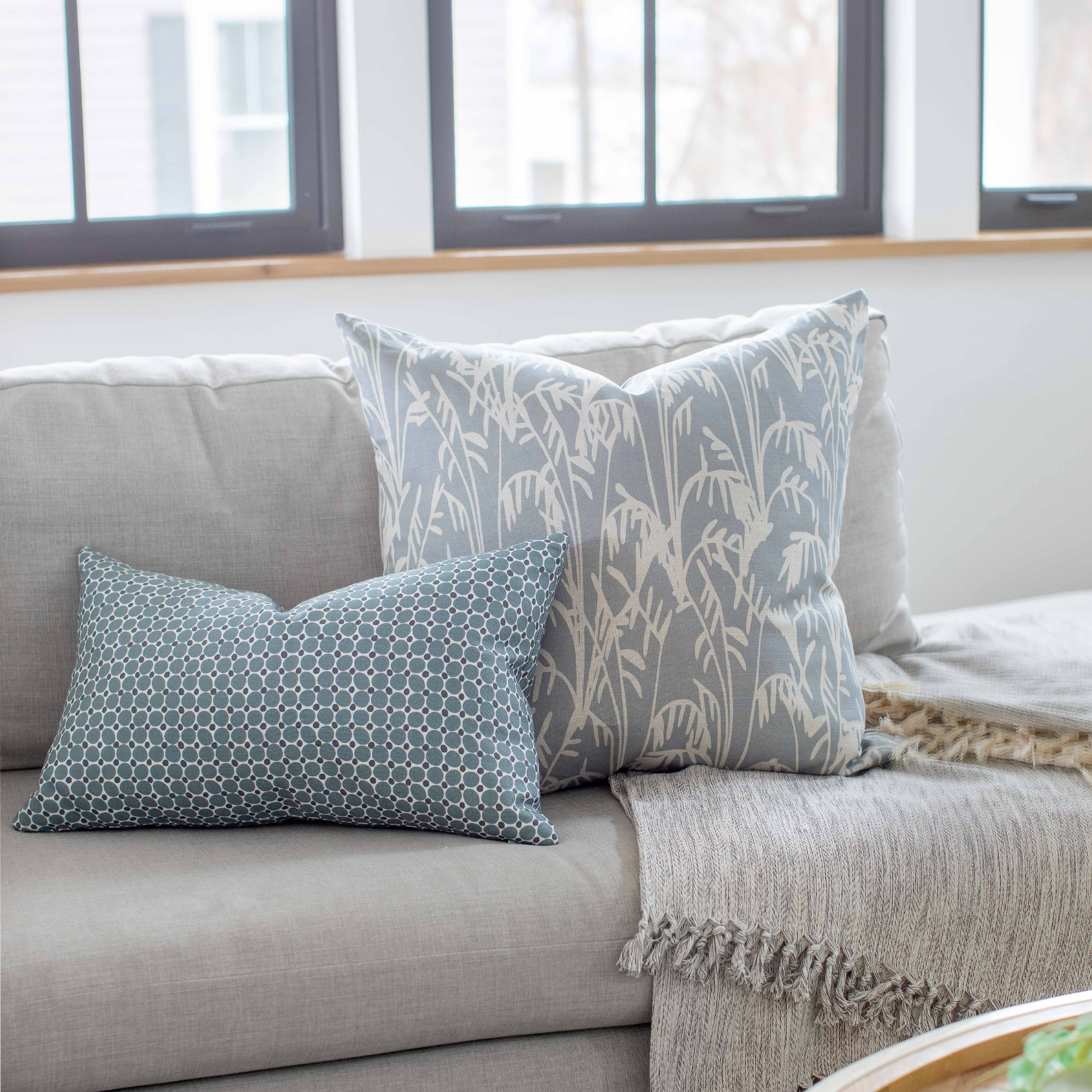 Cobblestone pillow in Gem styled by Emily Daws – placed on a vintage settee in a Charleston cottage