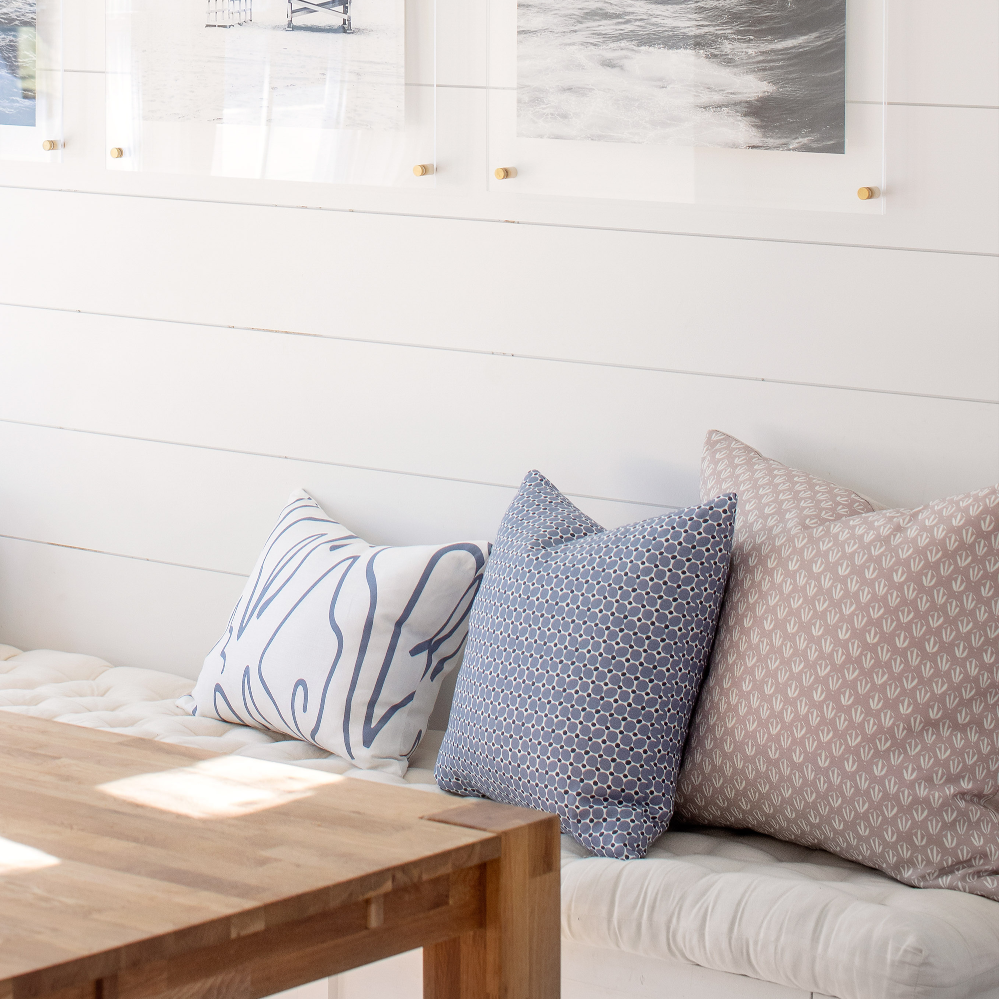 Cobblestone pillow in Ink styled by Emily Daws – placed on a vintage settee in a Charleston cottage