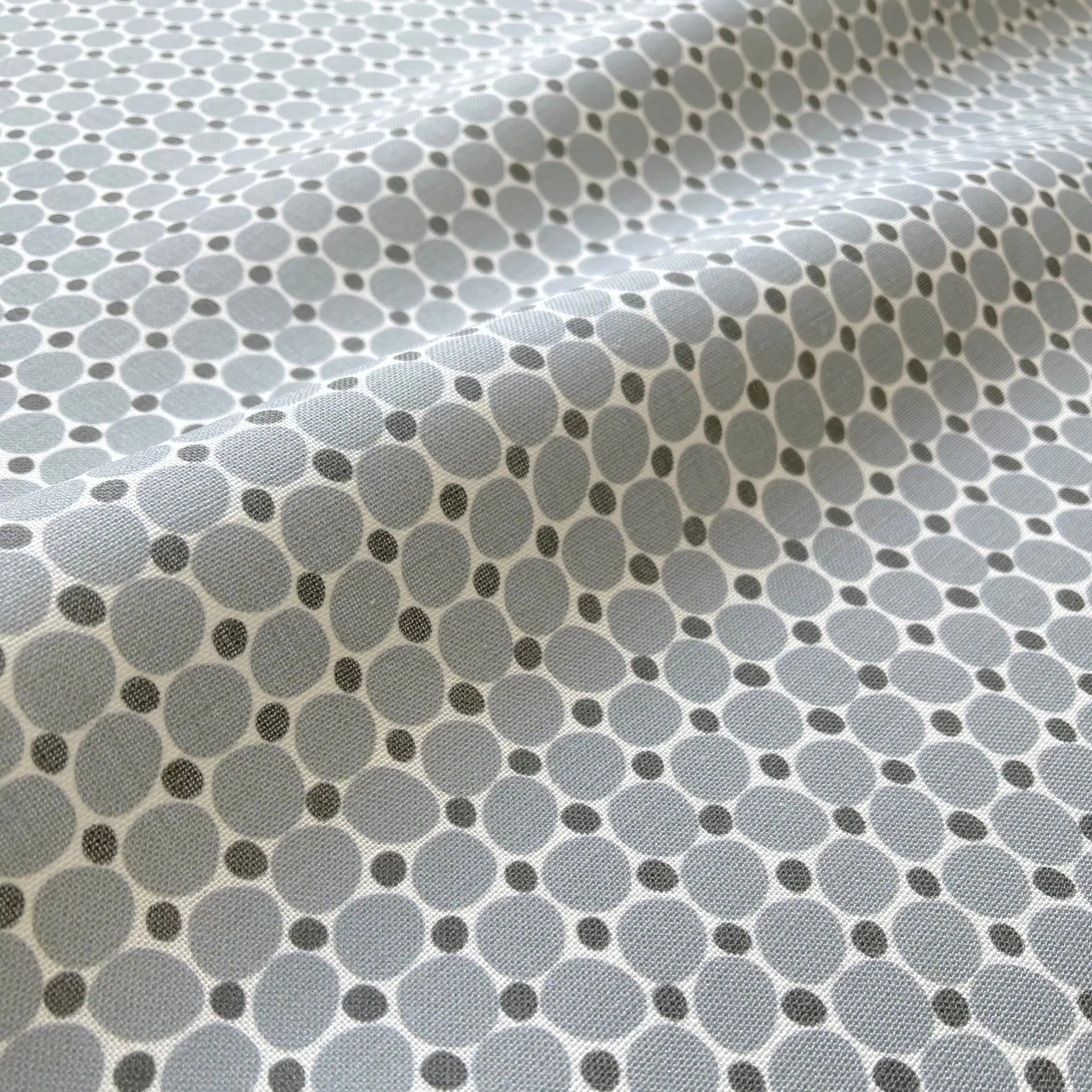 Cobblestone Lagoon pillow by Emily Daws styled in an interior — Charleston Collection